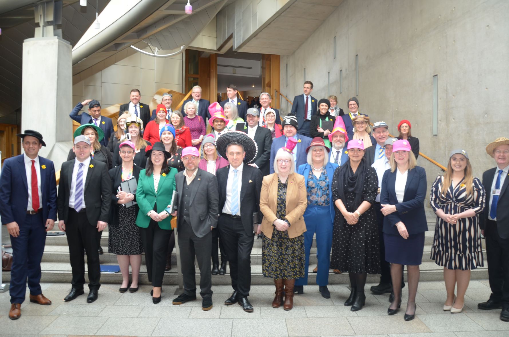 Beatrice Wishart and other MSPs supporting Wear A Hat Day at Holyrood
