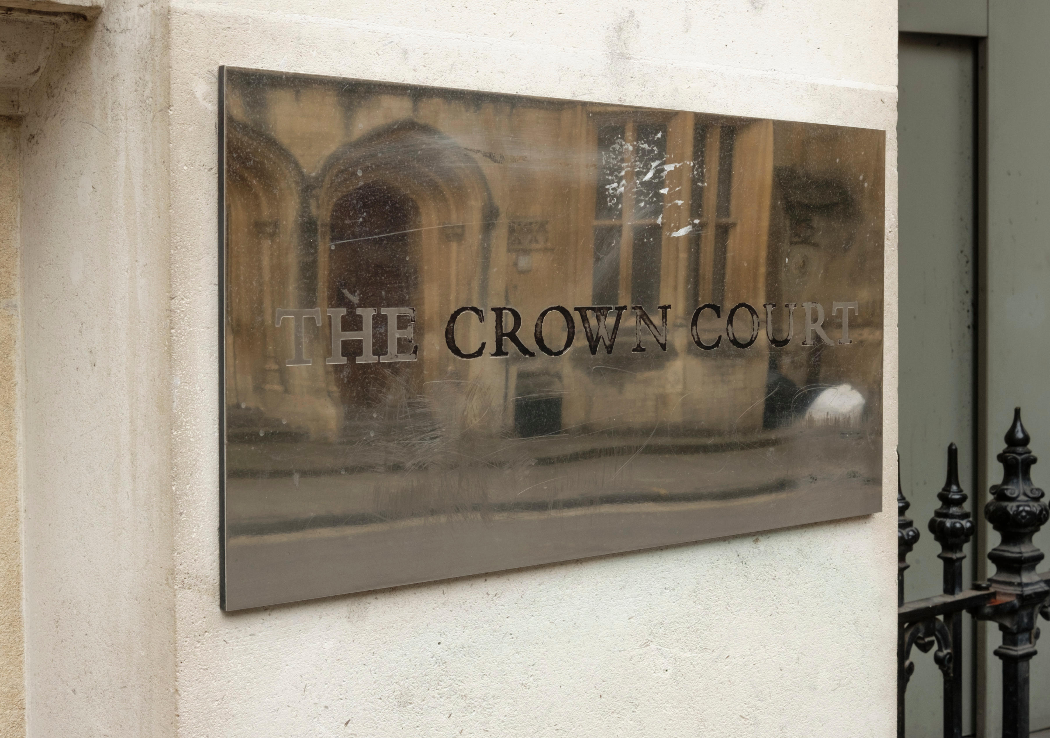 Brass crown court sign