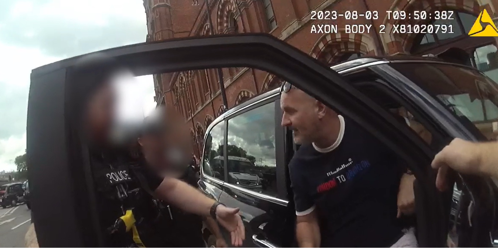 A still from body worn video footage of Redgrave getting out of his taxi as he was arrested.