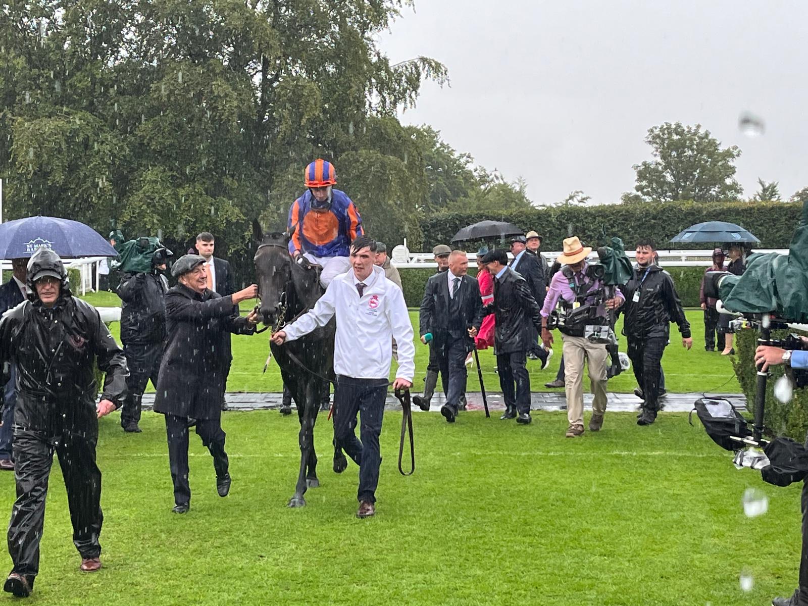 Derrick Smith congratulates Ryan Moore aboard Whirl