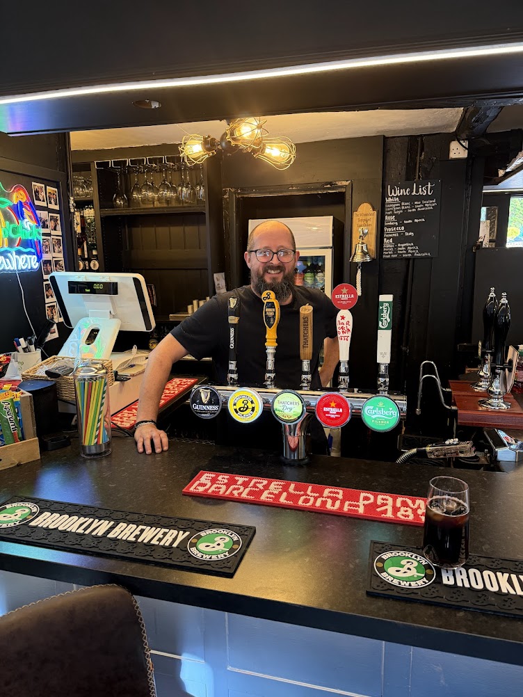 David Sutton behind the bar