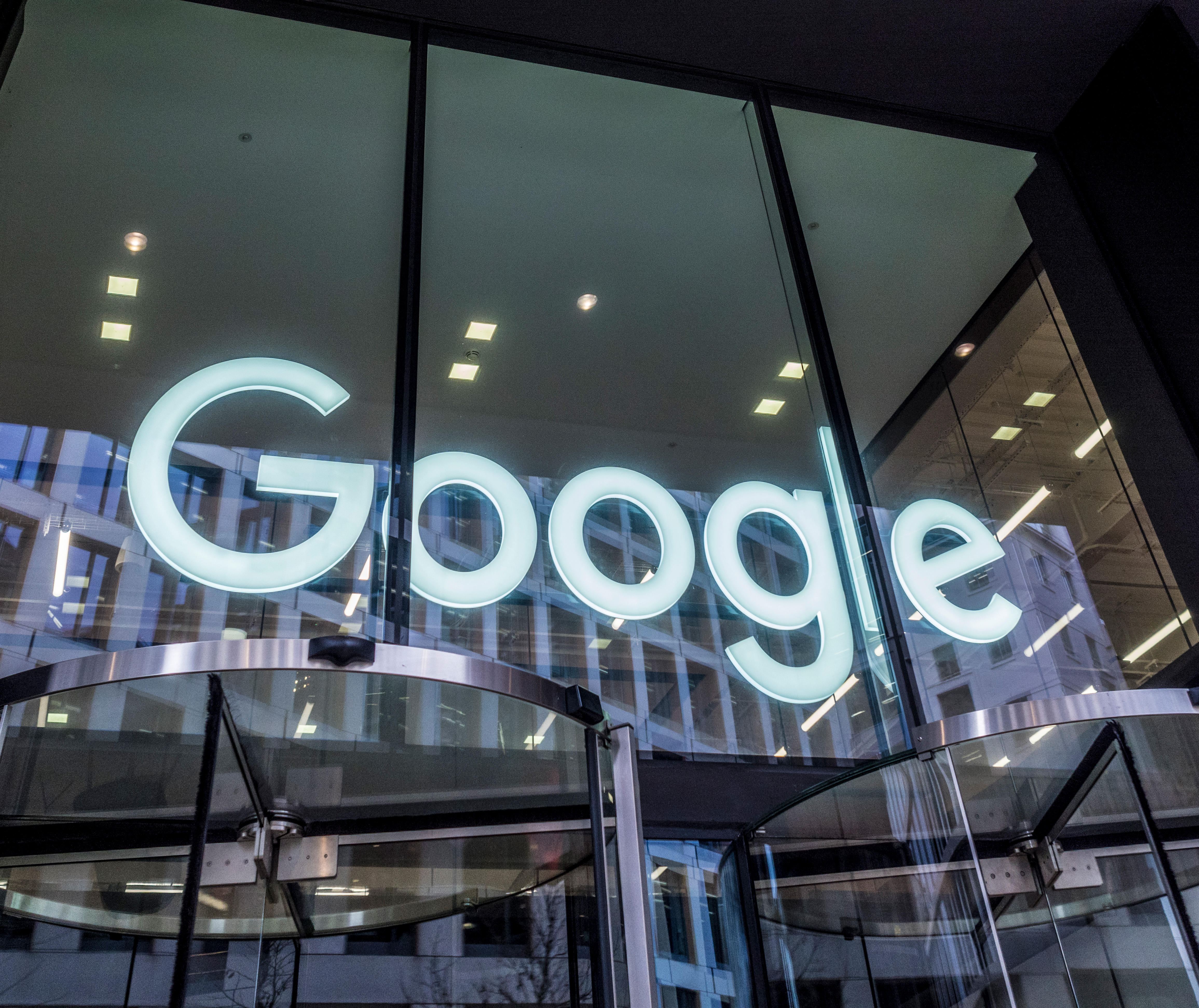 The Google logo displayed within an office building