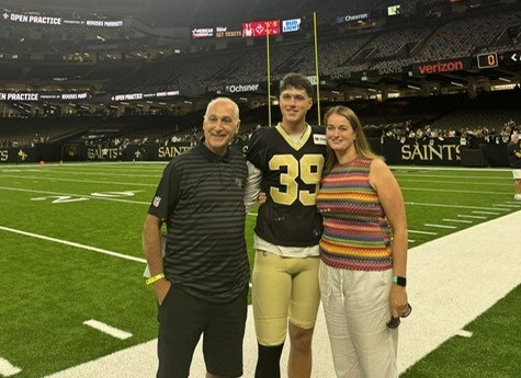 Charlie Smyth with parents, Leo and Julie, after his NFL regular-season debut for New Orleans Saints