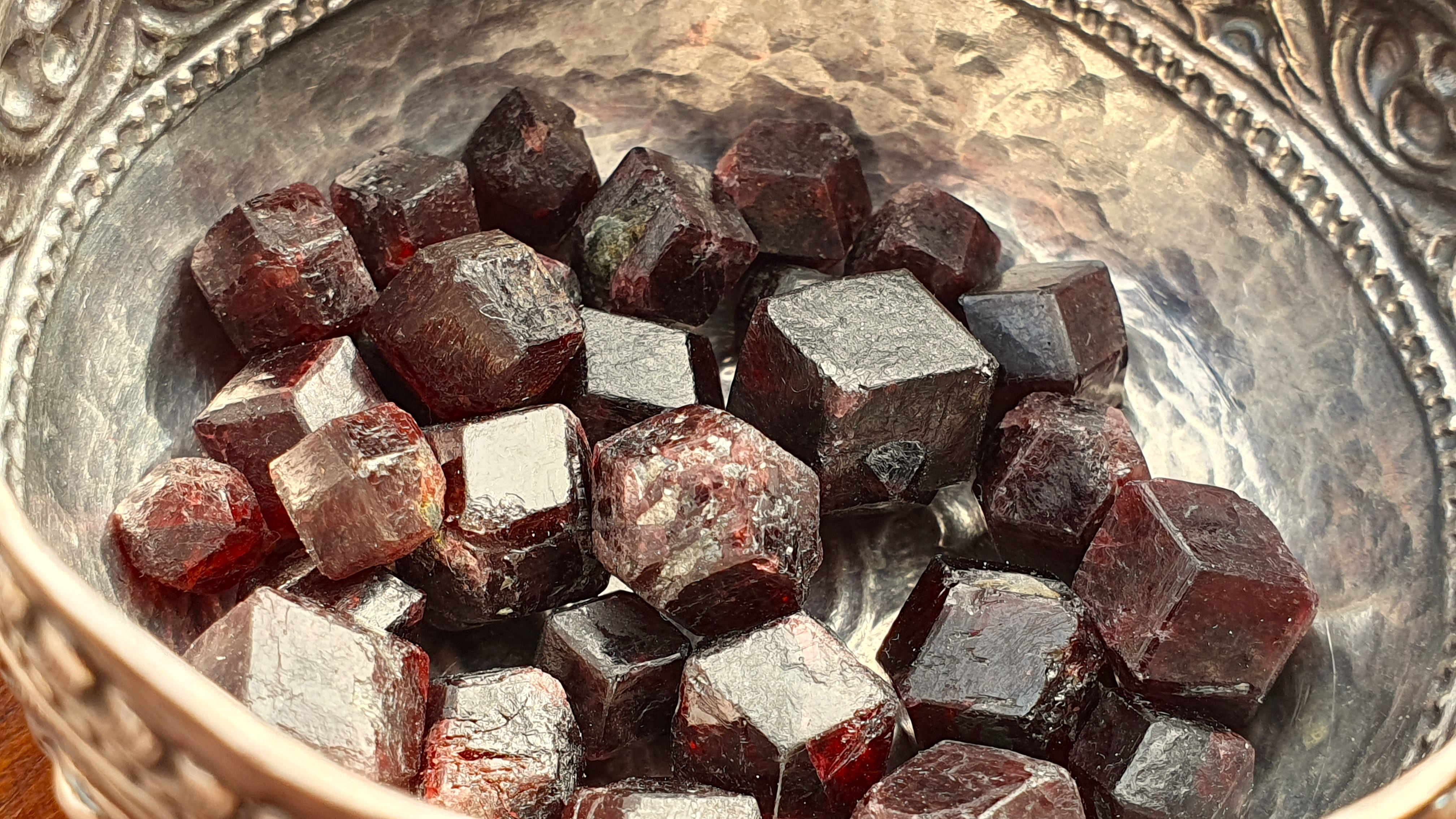 Natural garnet crystals showing rhombic dodecahedral shape
