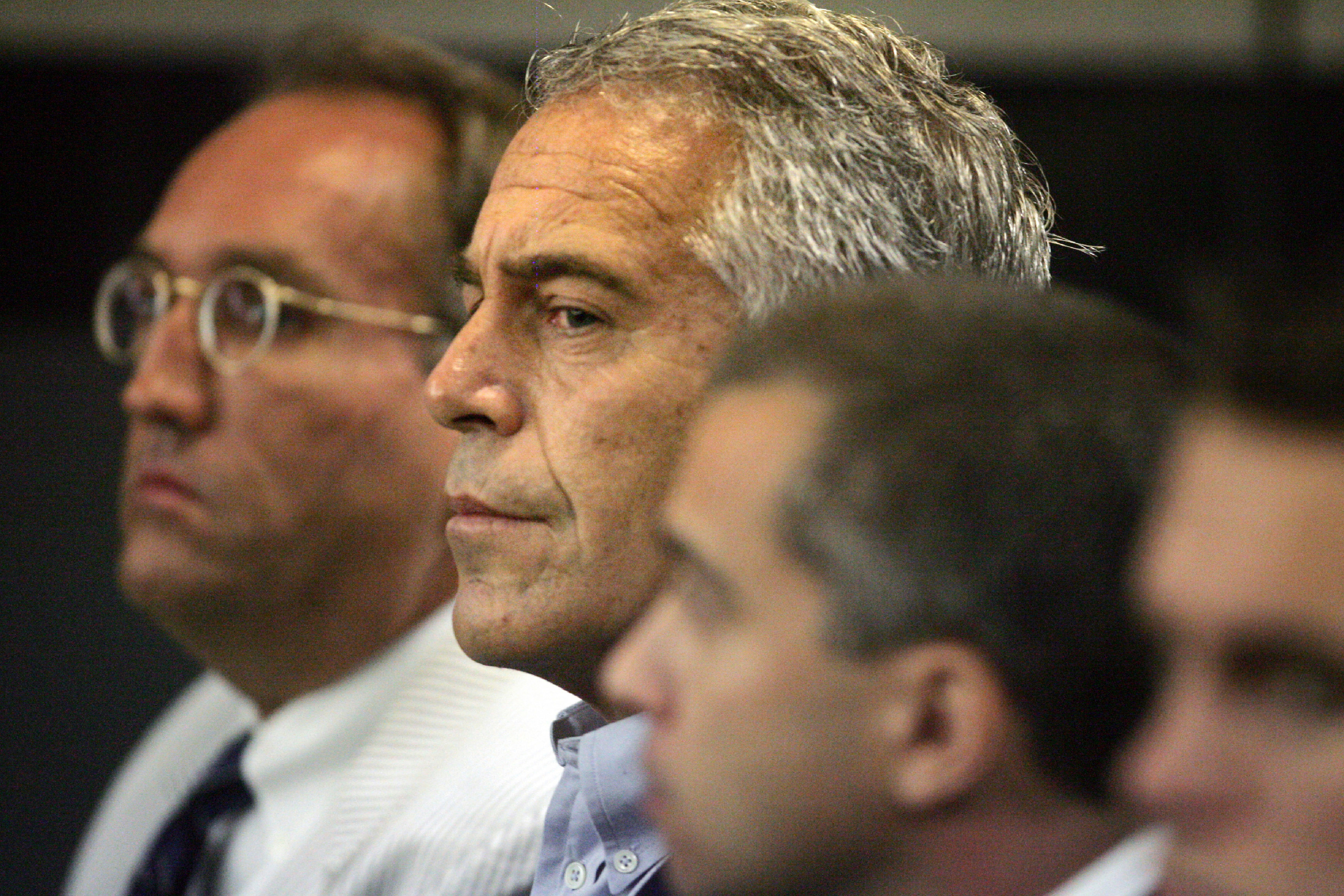 Jeffrey Epstein, centre, appearing in court in West Palm Beach, Florida, in July 2008