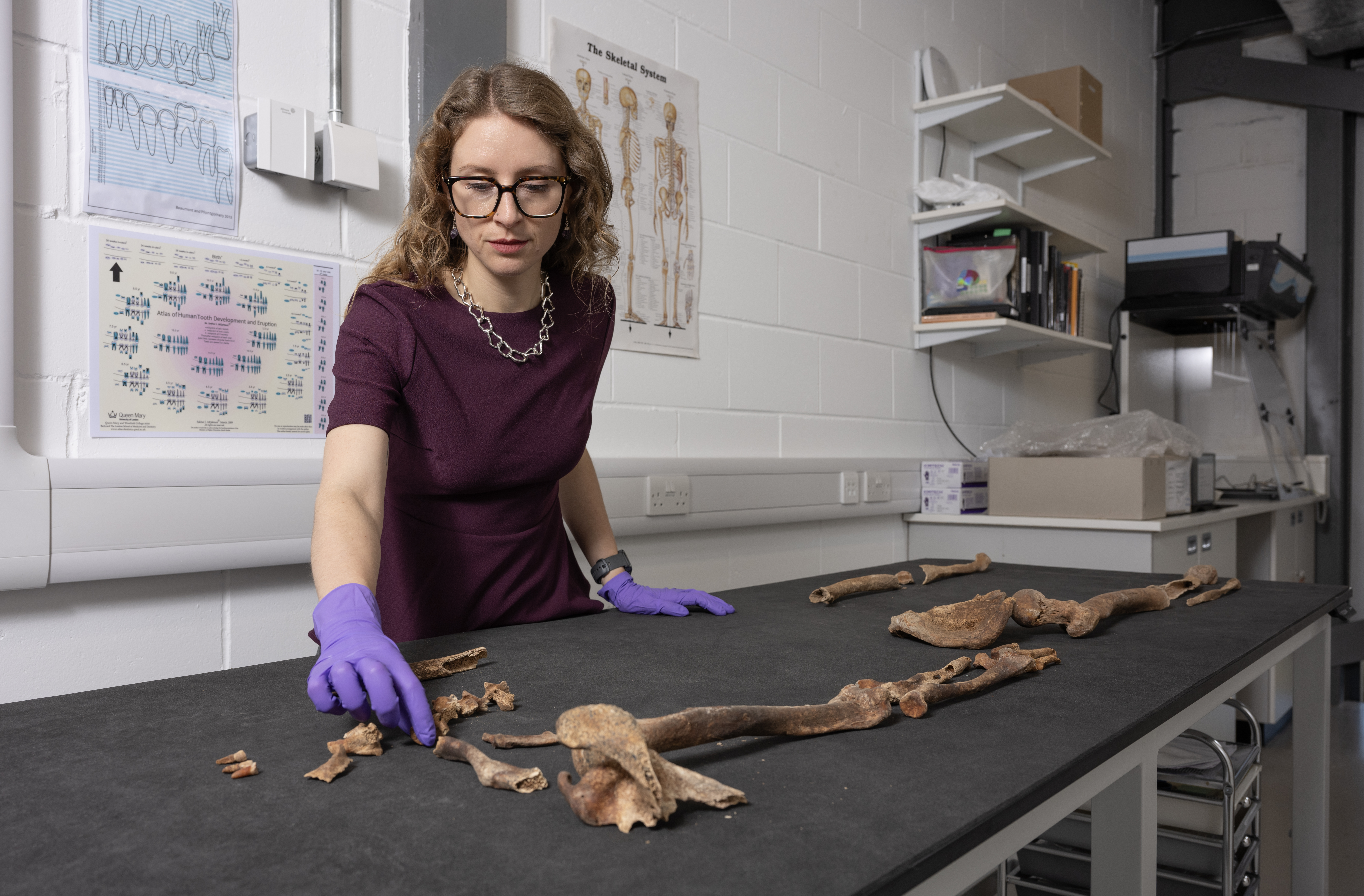 Dr Jess Thompson with skeletal remains from the Rhubodach cist