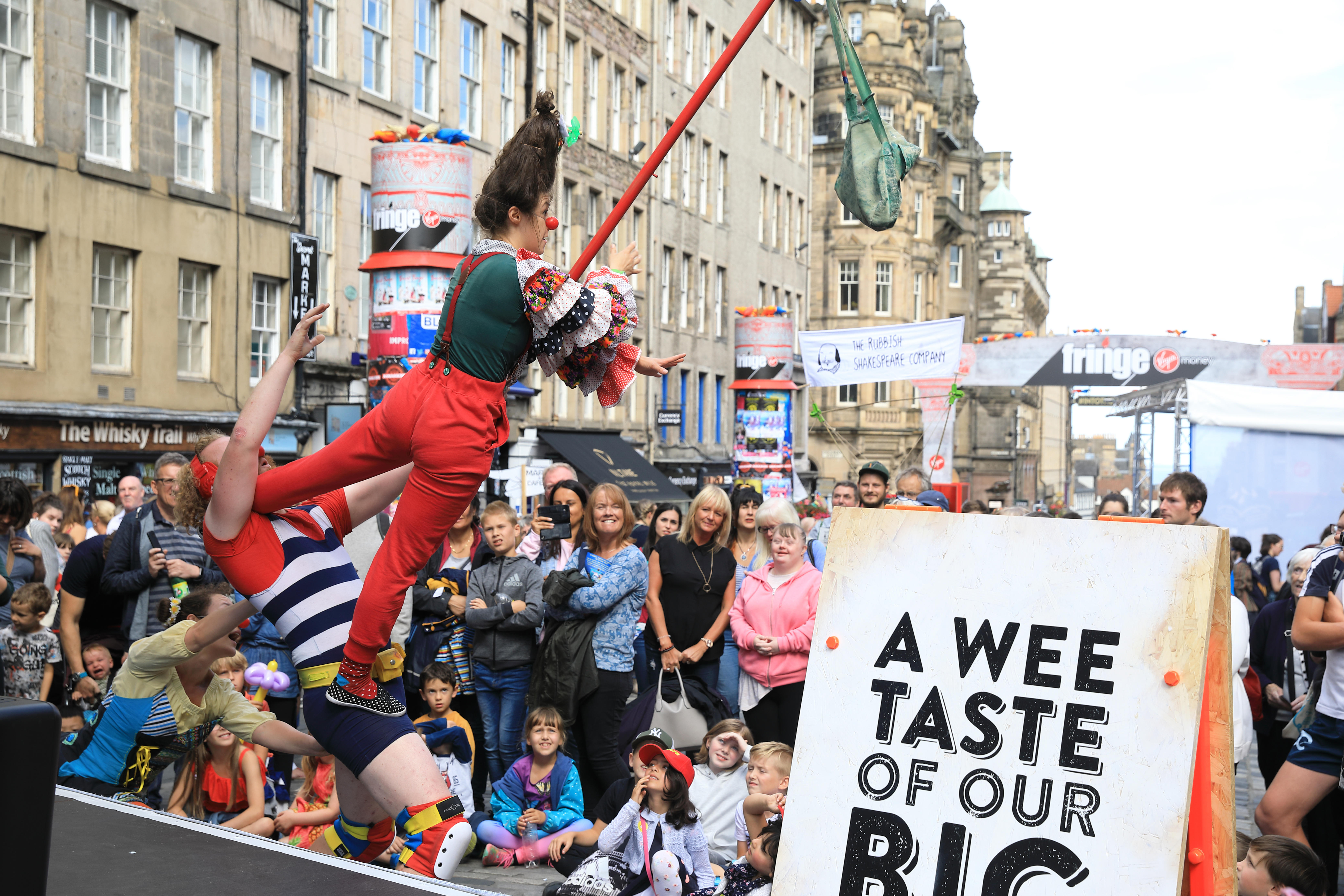 People watching festival performers on Edinburgh's Royal Mile
