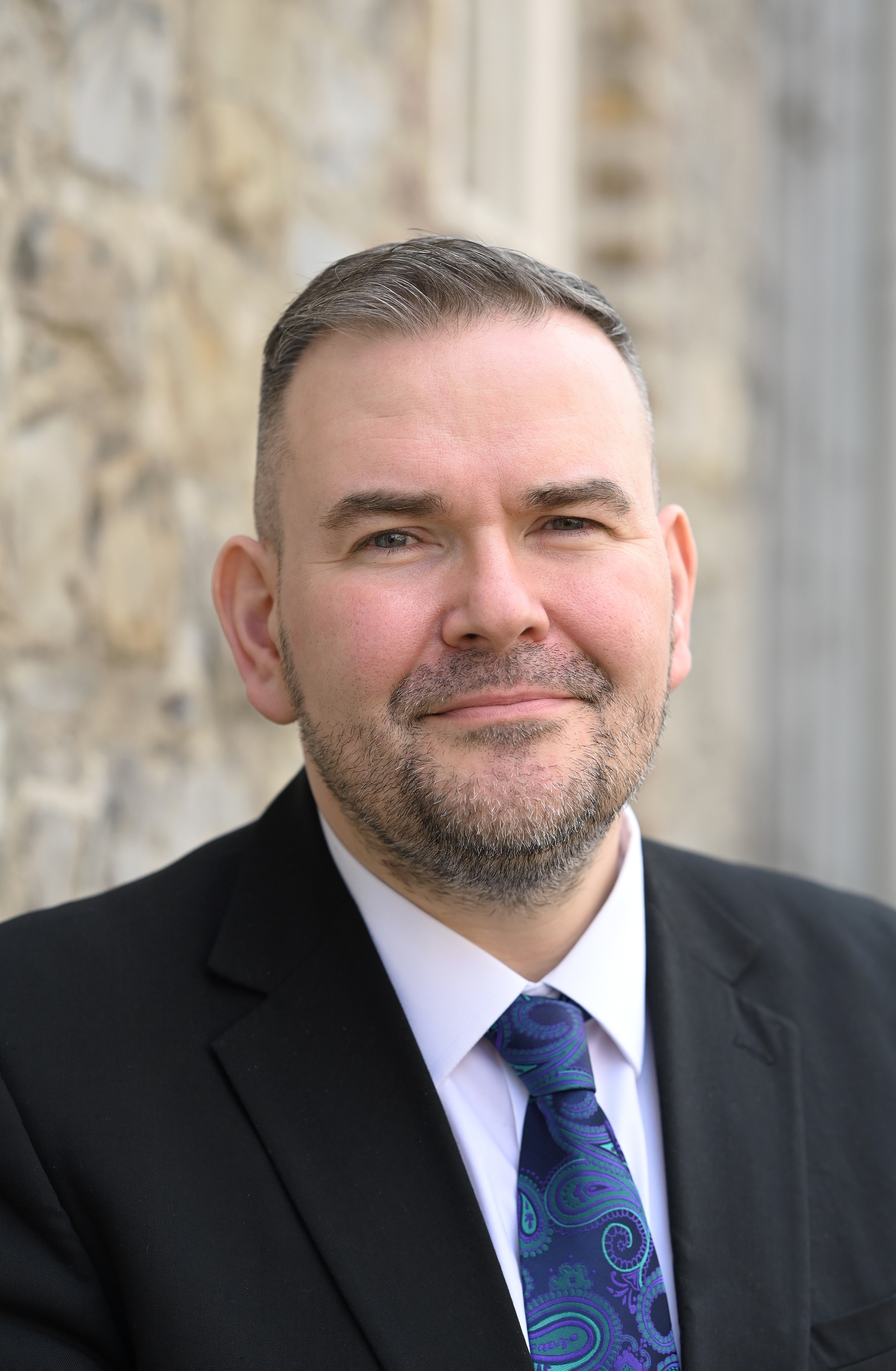 Headshot of Edward Mathews smiling