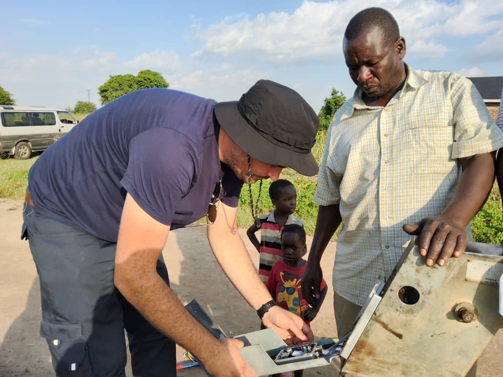 Handout image of Sennan Morris of Atlantic Technological University at a water pump in Uganda