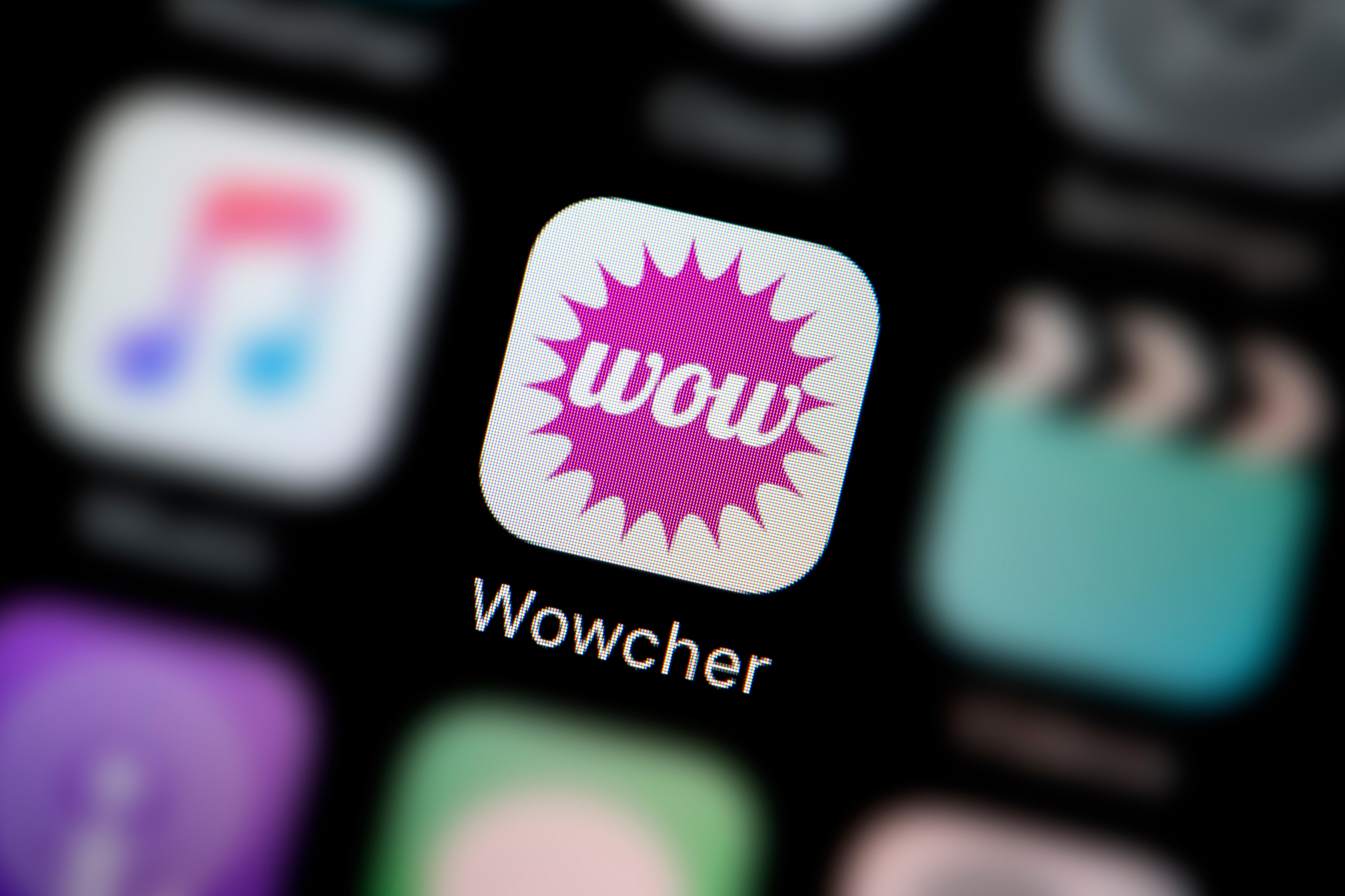 A close-up shot of the logo representing the Wowcher app icon, as seen on the screen of a smart phone