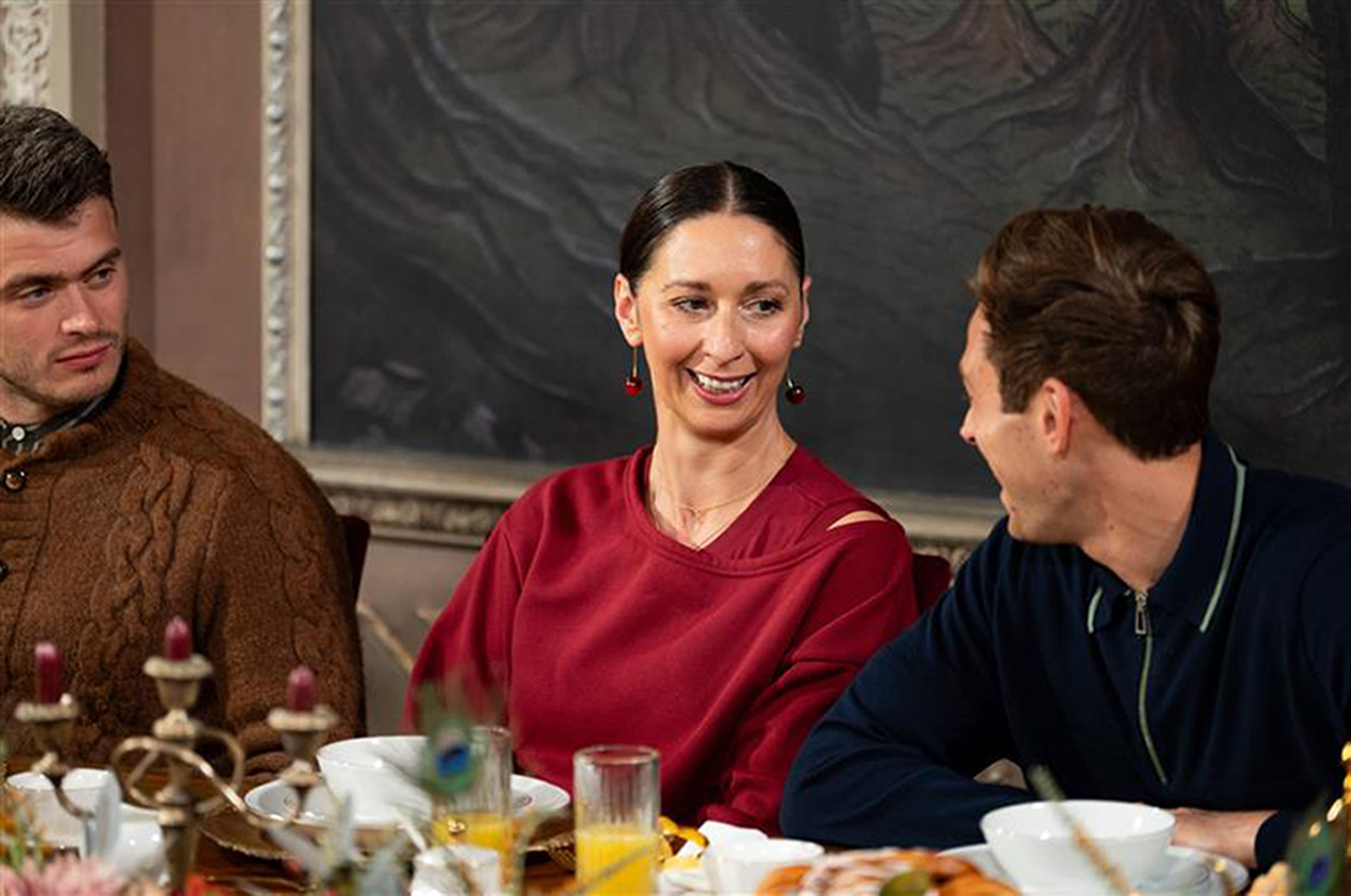 Rachel from The Traitors sits at a table