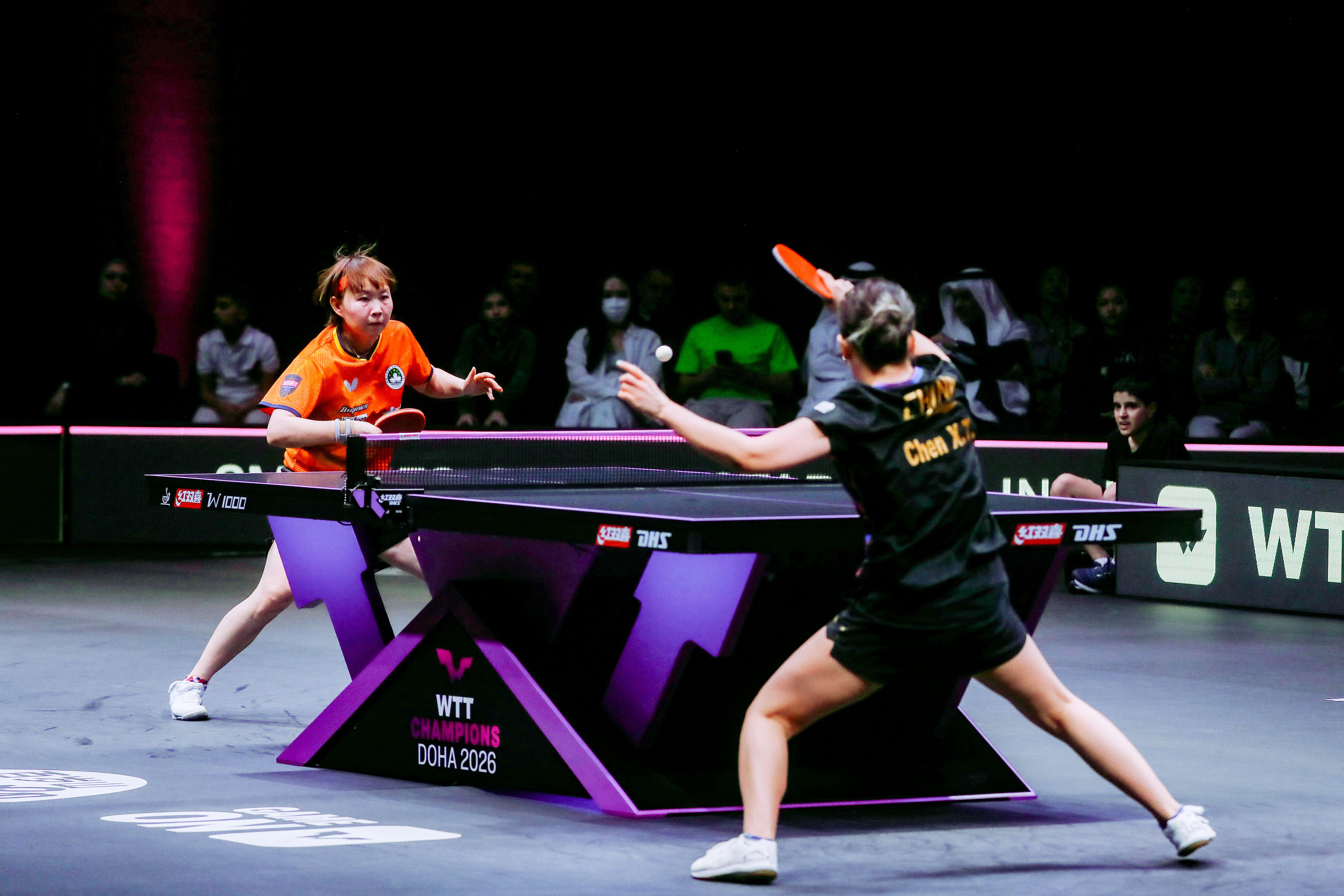 China's Chen Xingtong strikes back against Macau's Zhu Yuling during their women's singles final match in the World Table Tennis (WTT) Champions tournament at the Infinity Arena.