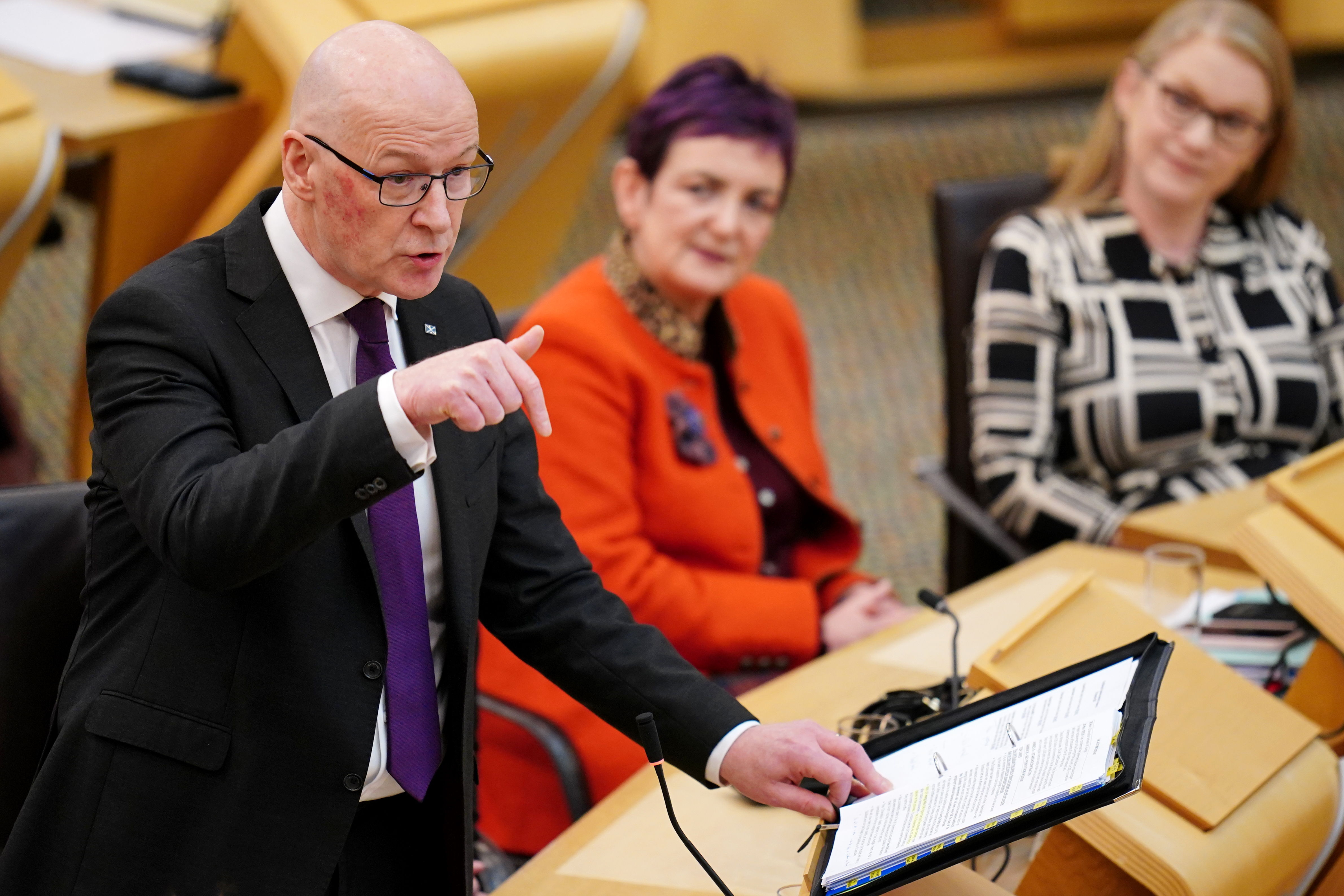 John Swinney speaks during a Scottish Parliament debate
