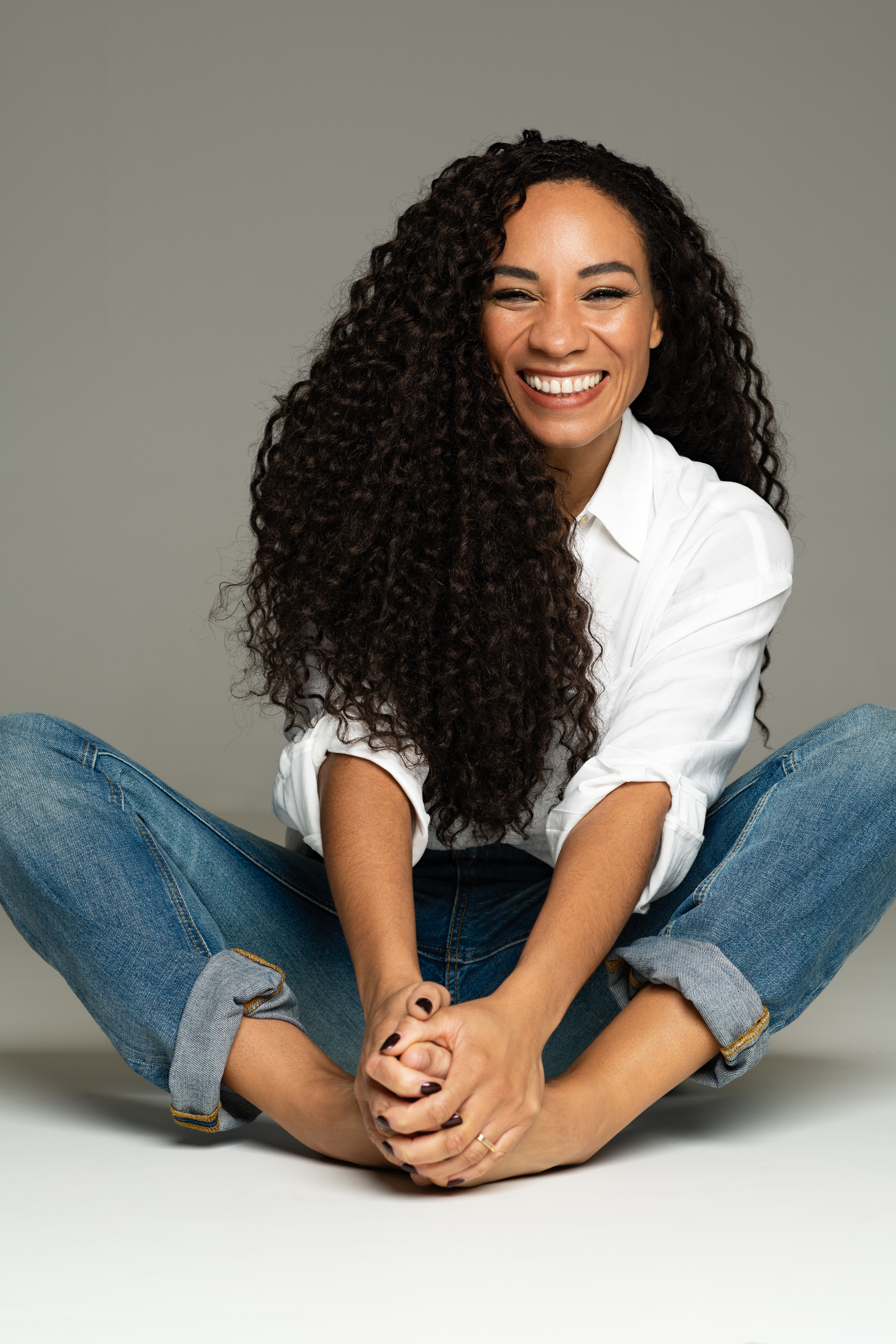 Michelle Ackerley sitting on the floor (Charl Marais/PA)