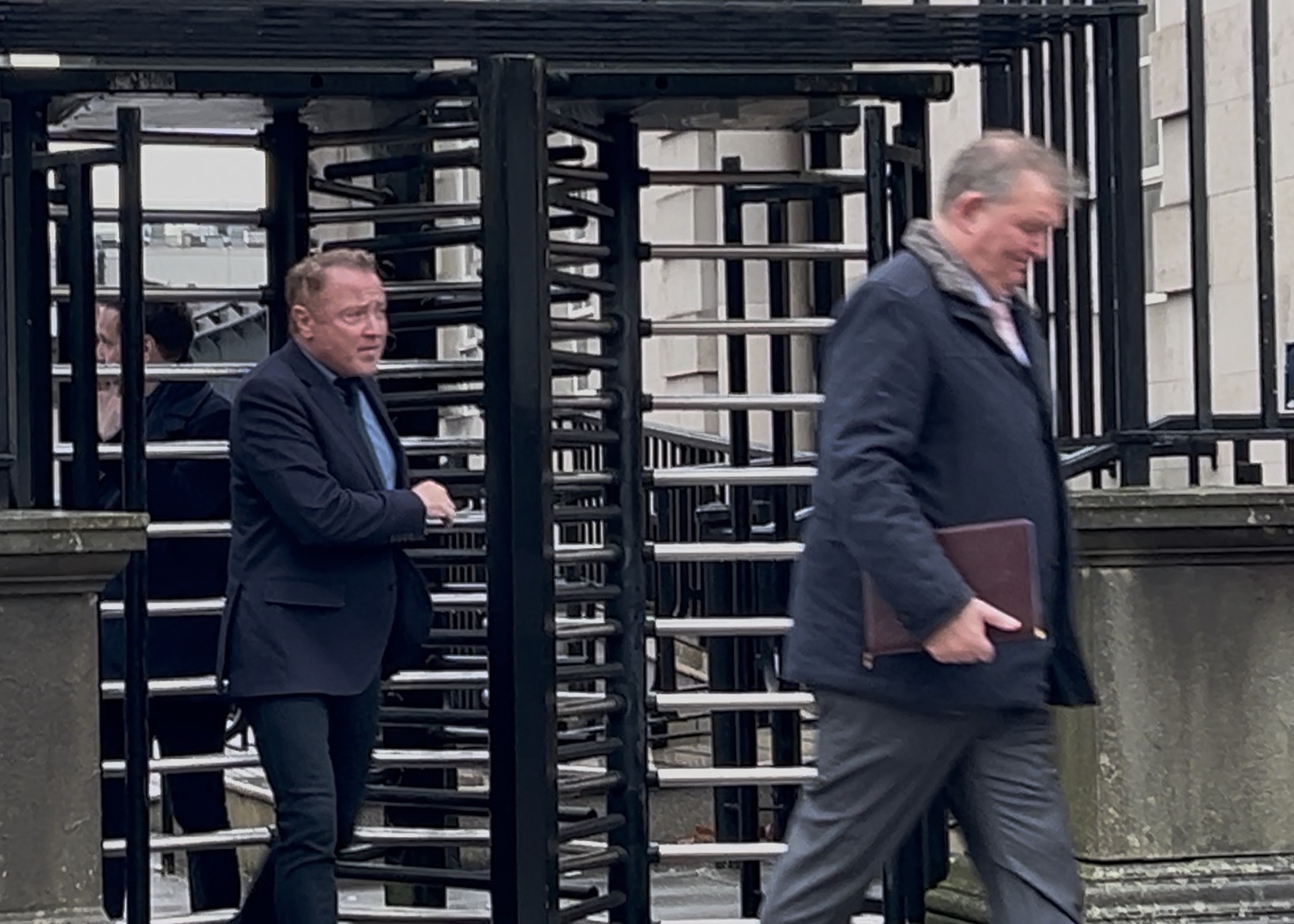 Michael Flatley exiting a large gate