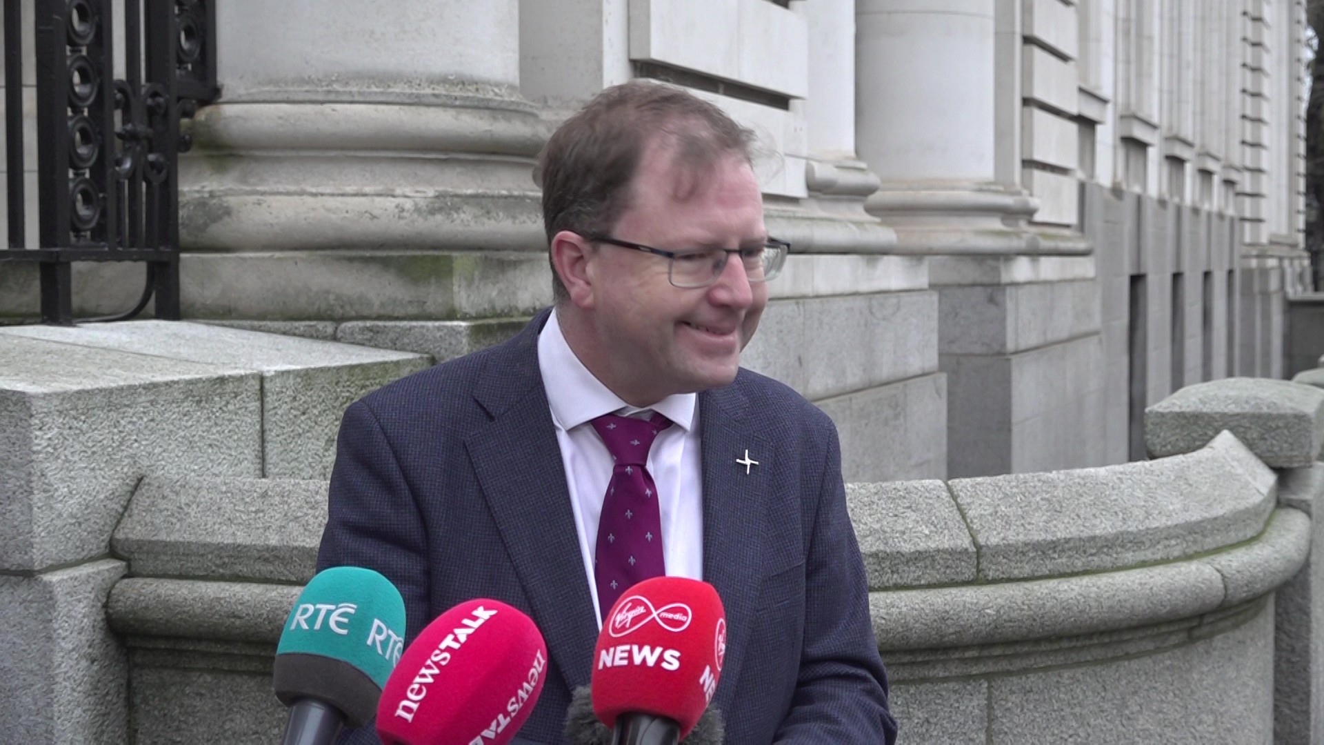 Minister James Lawless speaking to the media outside Government Buildings in Dublin