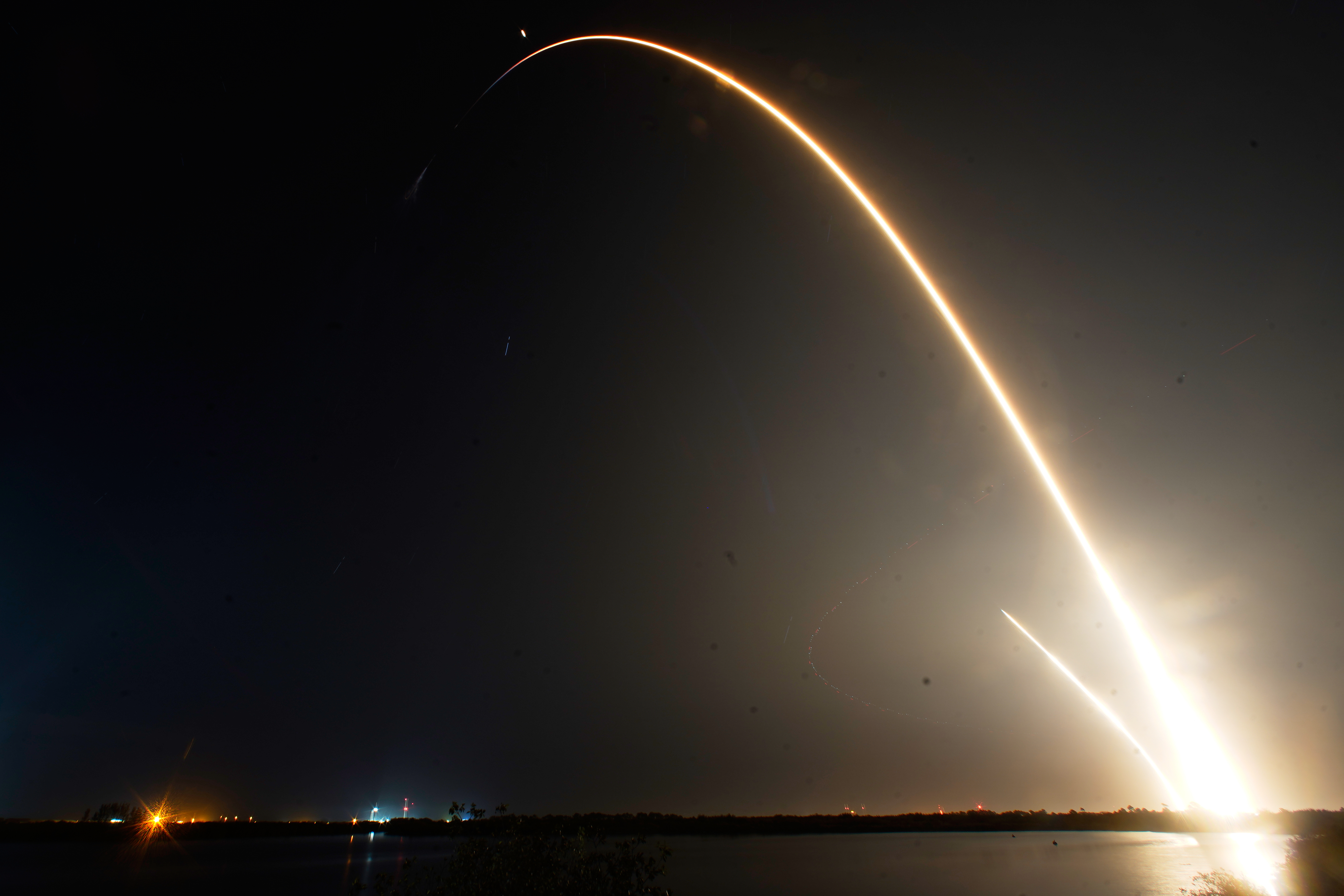  A SpaceX Falcon 9 rocket with a crew of four aboard the Dragon space craft is seen during a time exposure as it lifts off from pad 40 at the Cape Canaveral Space Force Station in Cape Canaveral, Florida