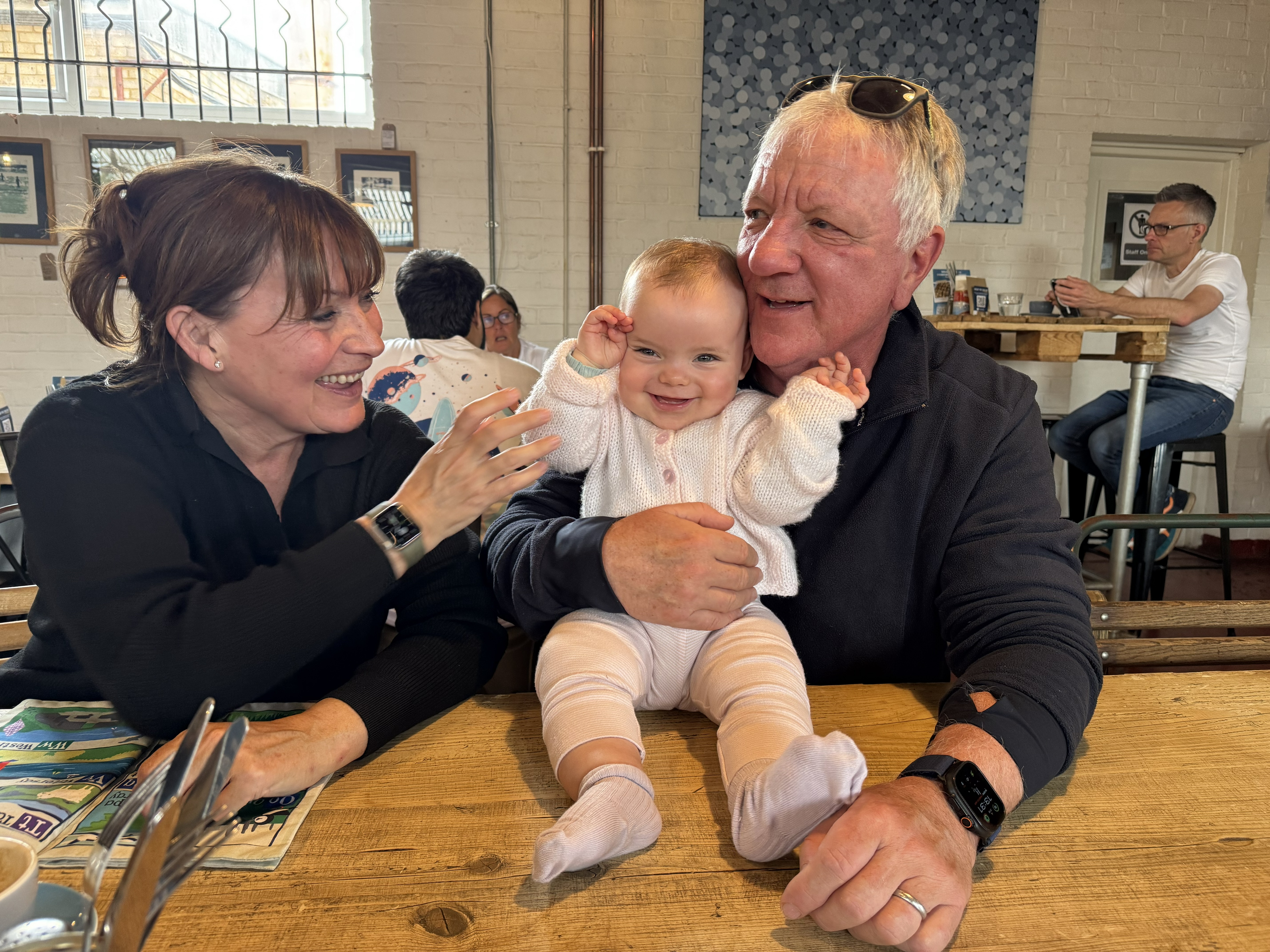 Lorraine Kelly and husband Steve Smith with their granddaughter Billie (Rosie Kelly Smith/PA)