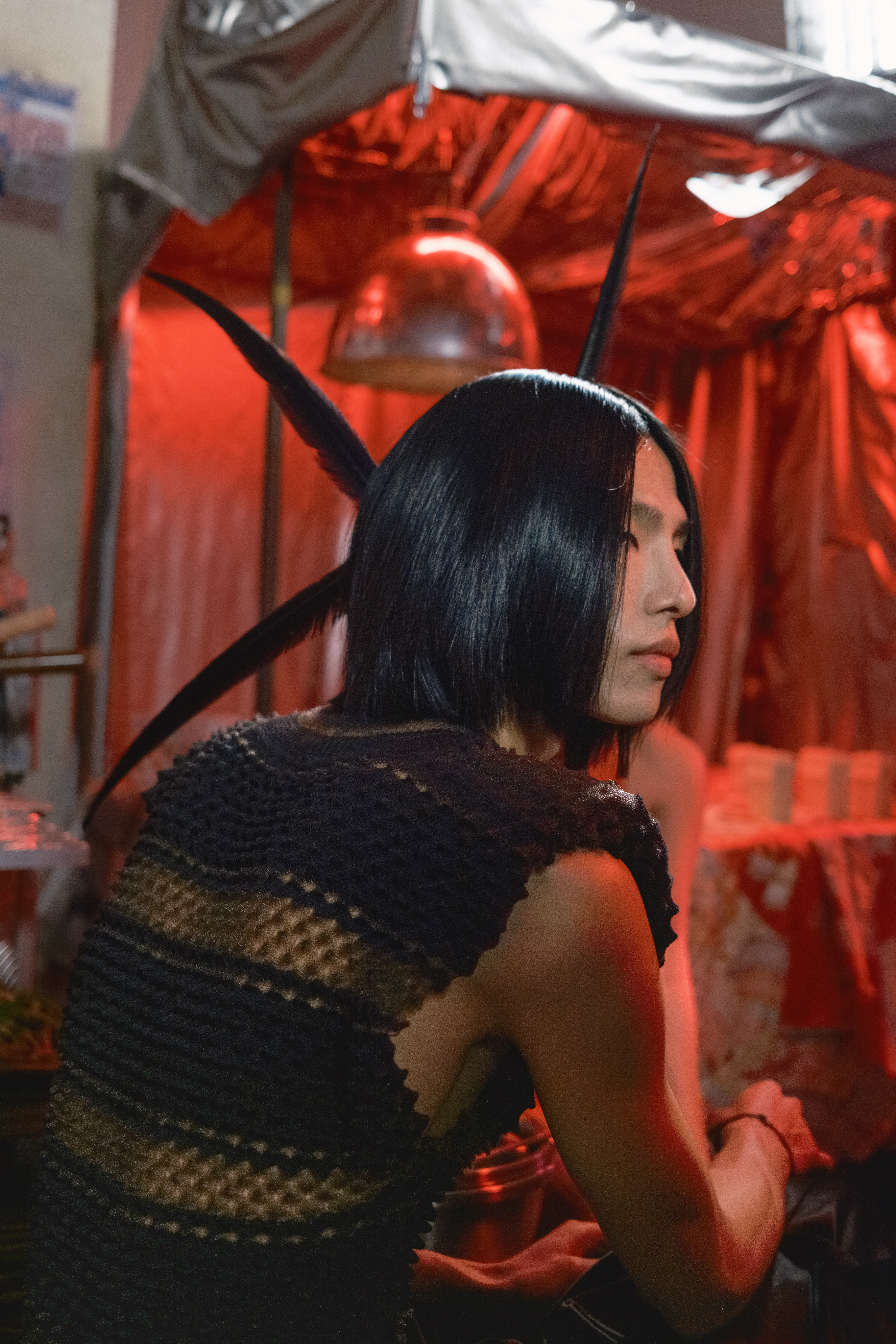 Model with feathers in hair