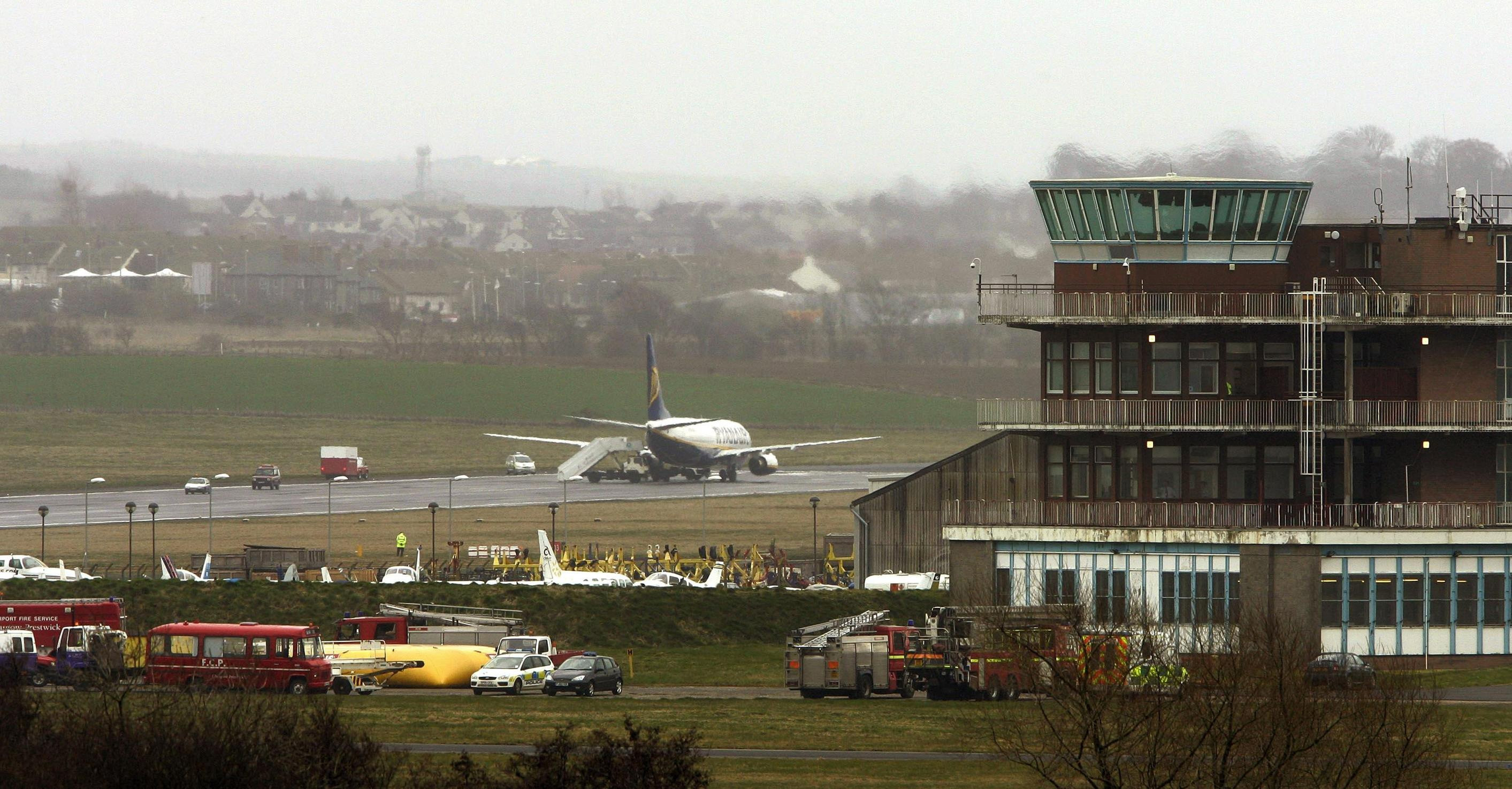 A plane on the Tarmac and the main terminal building at Prestwick Airport