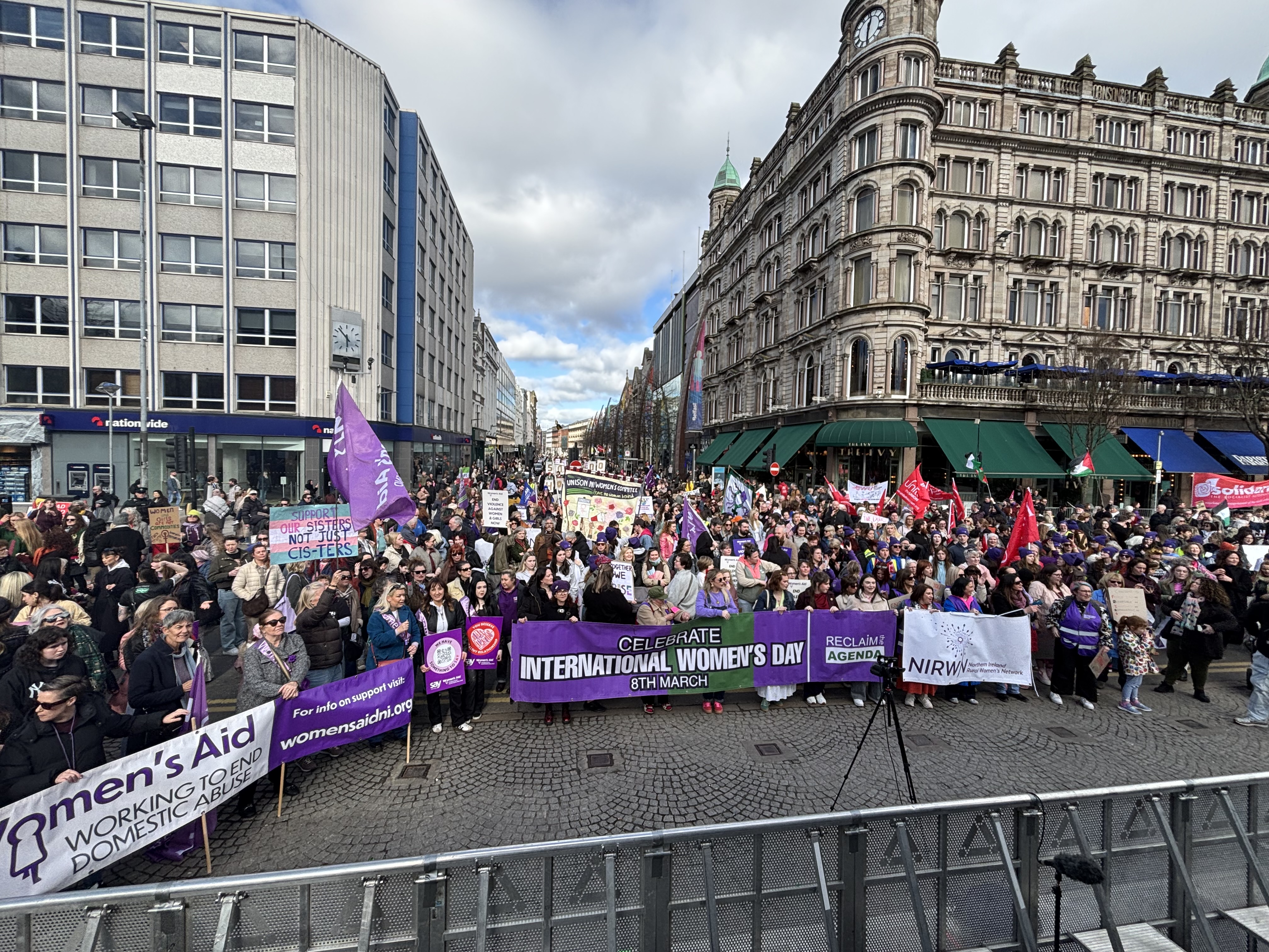 Crowds gather in front of Belfast City Hall for an International Women's Day rally