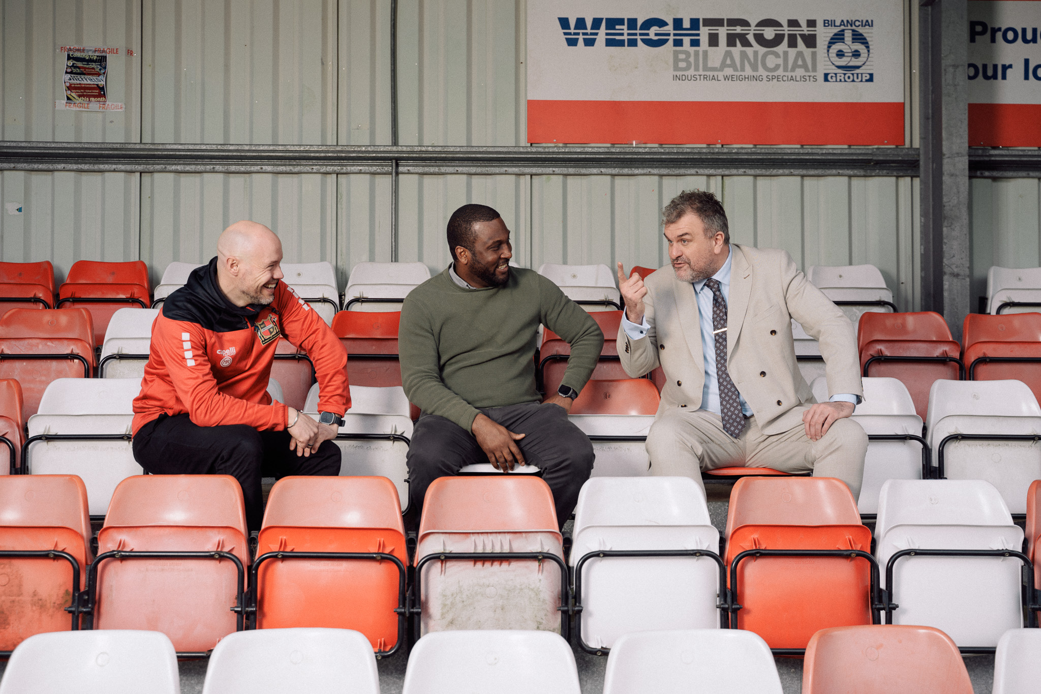 Jon McClure talks with men's manager Vill Powell and player Matt Rooney