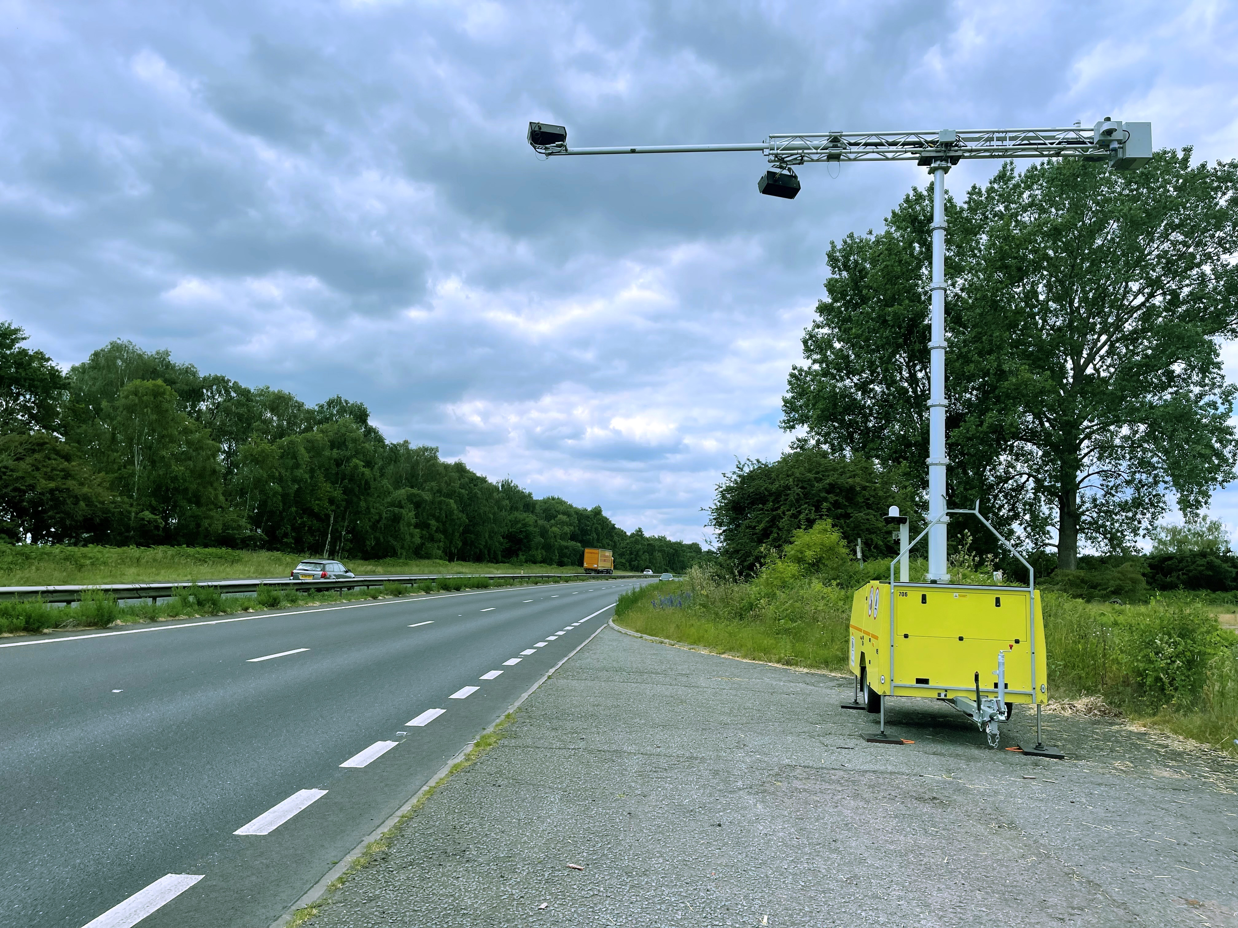 A camera on a mobile unit, fixed above a dual-carriageway