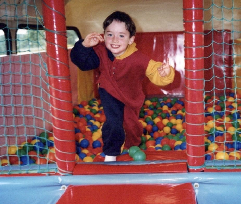 Ross Irvine playing in a ball pool