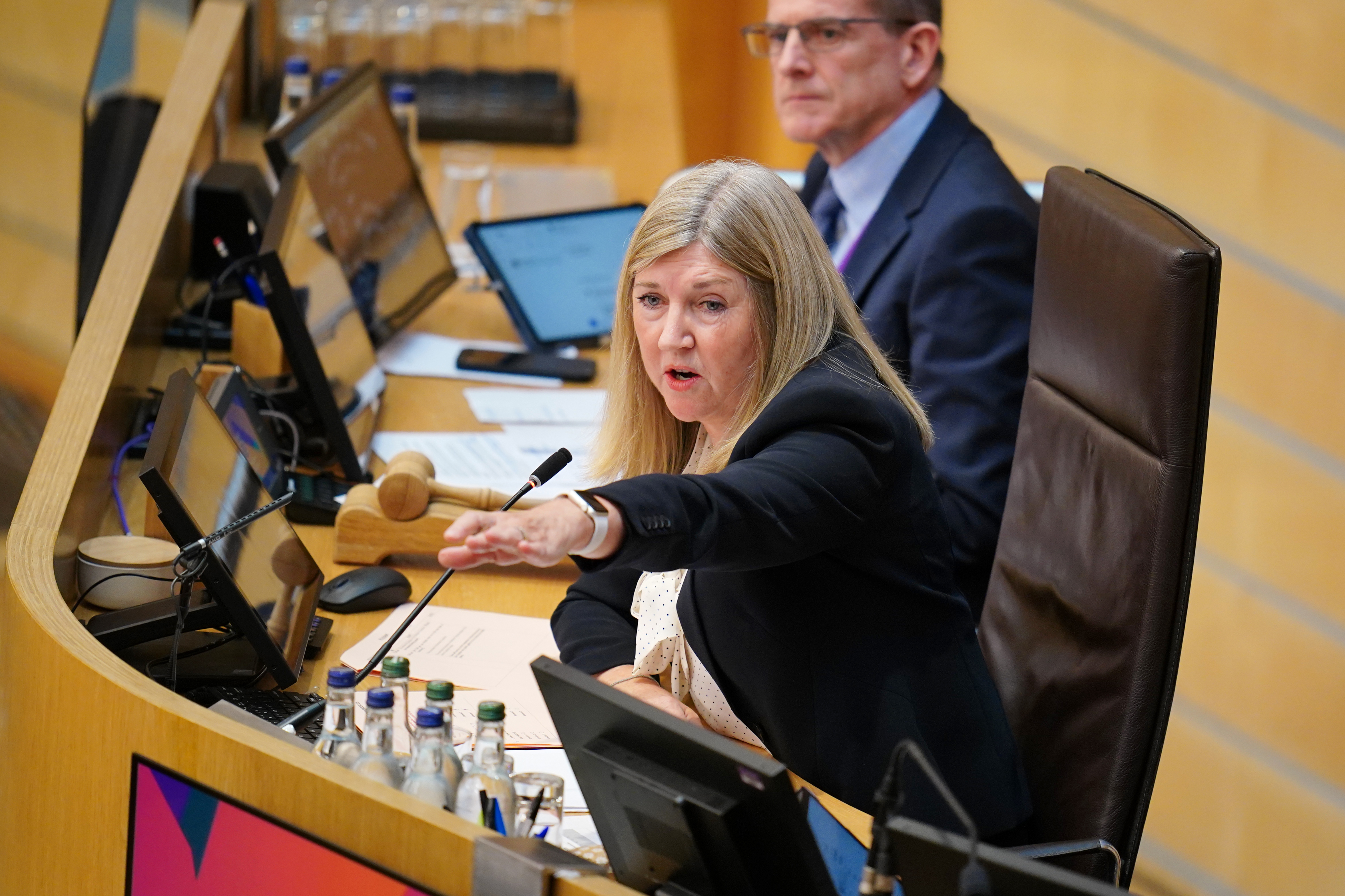 Holyrood Presiding Officer Alison Johnstone speaks to an MSP during a Scottish Parliament debate