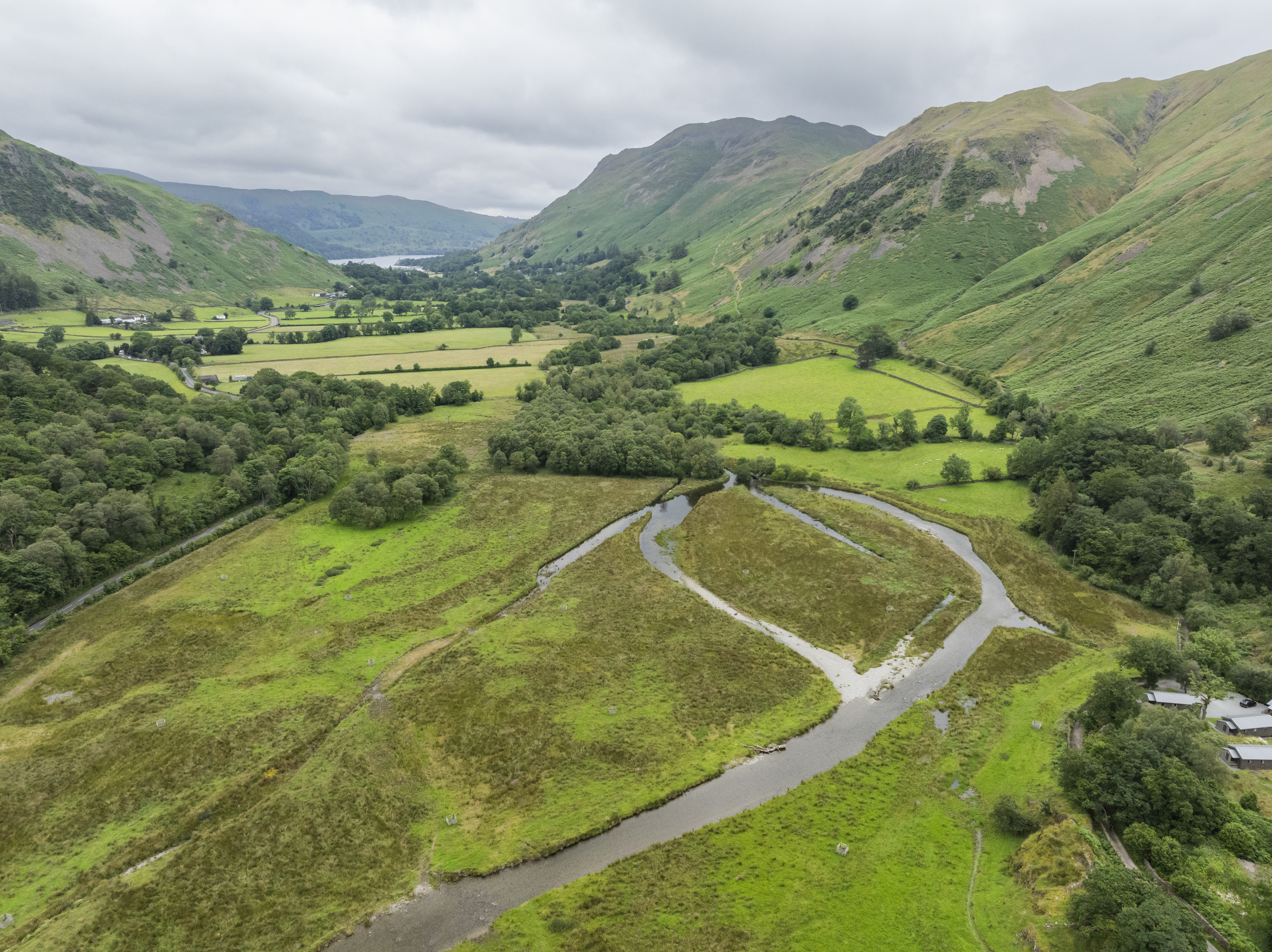 An aerial view of former farmland around Ullswater, Godrill Beck, showing the floodplain