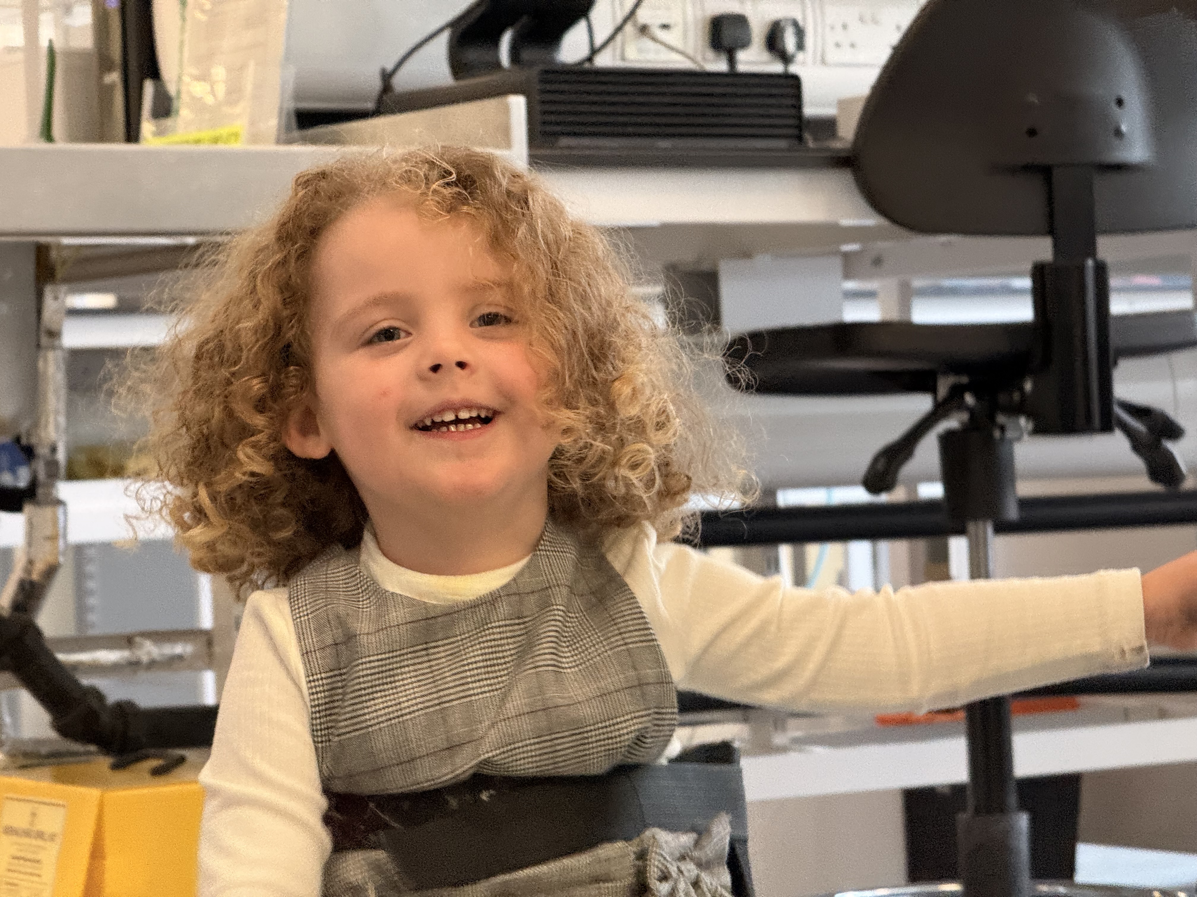 Grayce Pearson, who has SMA, in the lab where they will test newborns for the condition