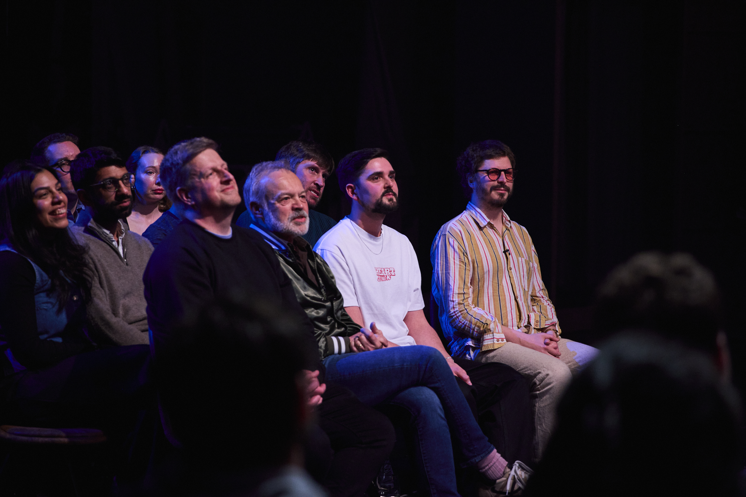 Graham Norton sits among audience members