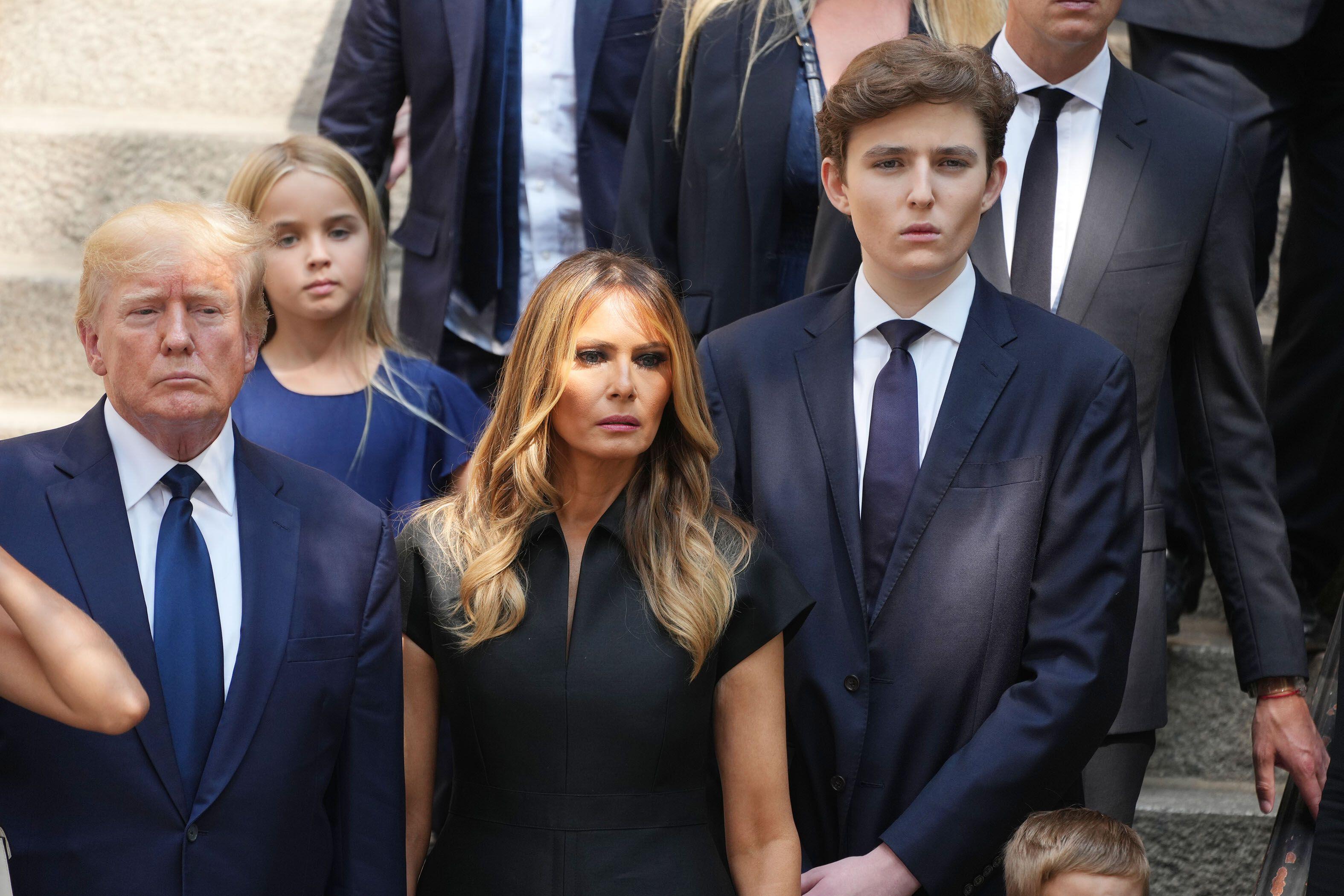 Barron Trump, right, with his parents