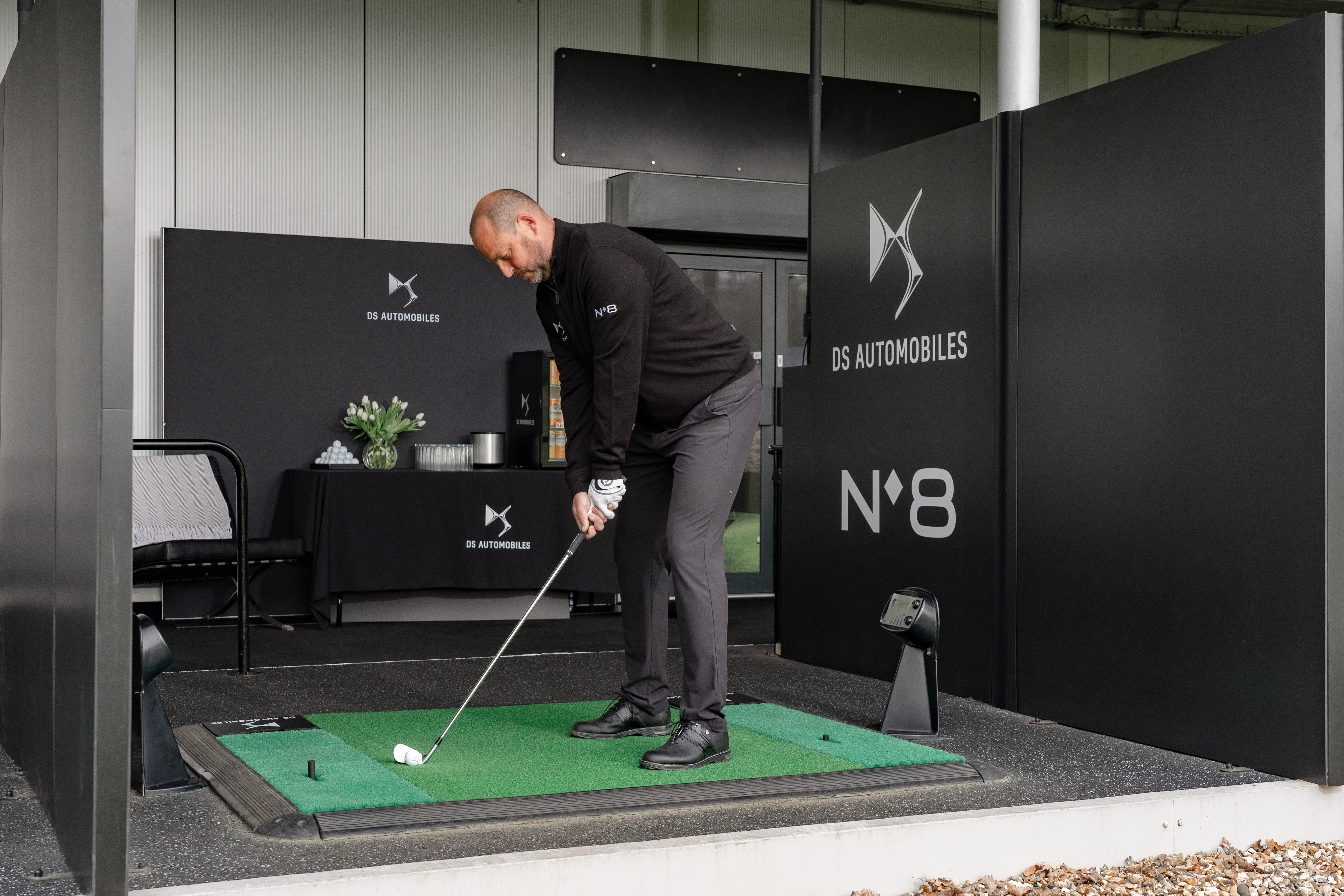 Former golfer David Howell lines up a shot on the driving range 