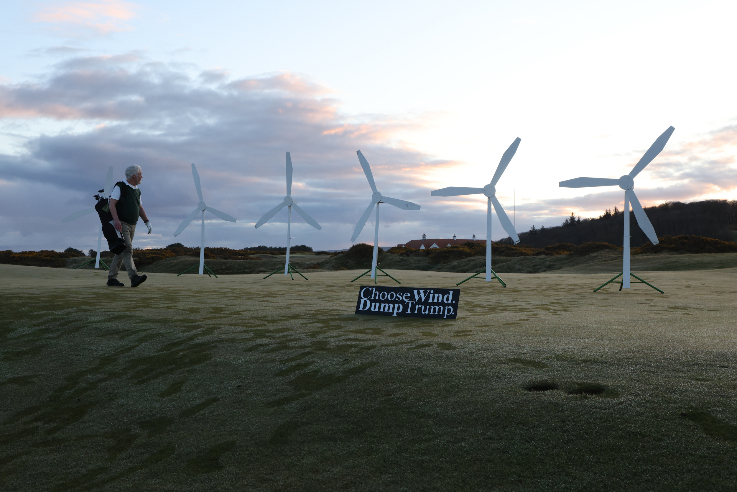 Greenpeace activists installed a mock wind farm on a green of the Trump Turnberry Golf Club