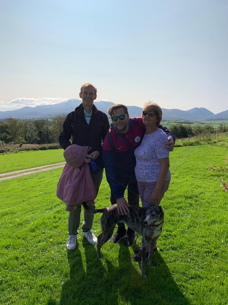 Neil Howarth pictured with his parents Peter and Rosemary and their dog Molly