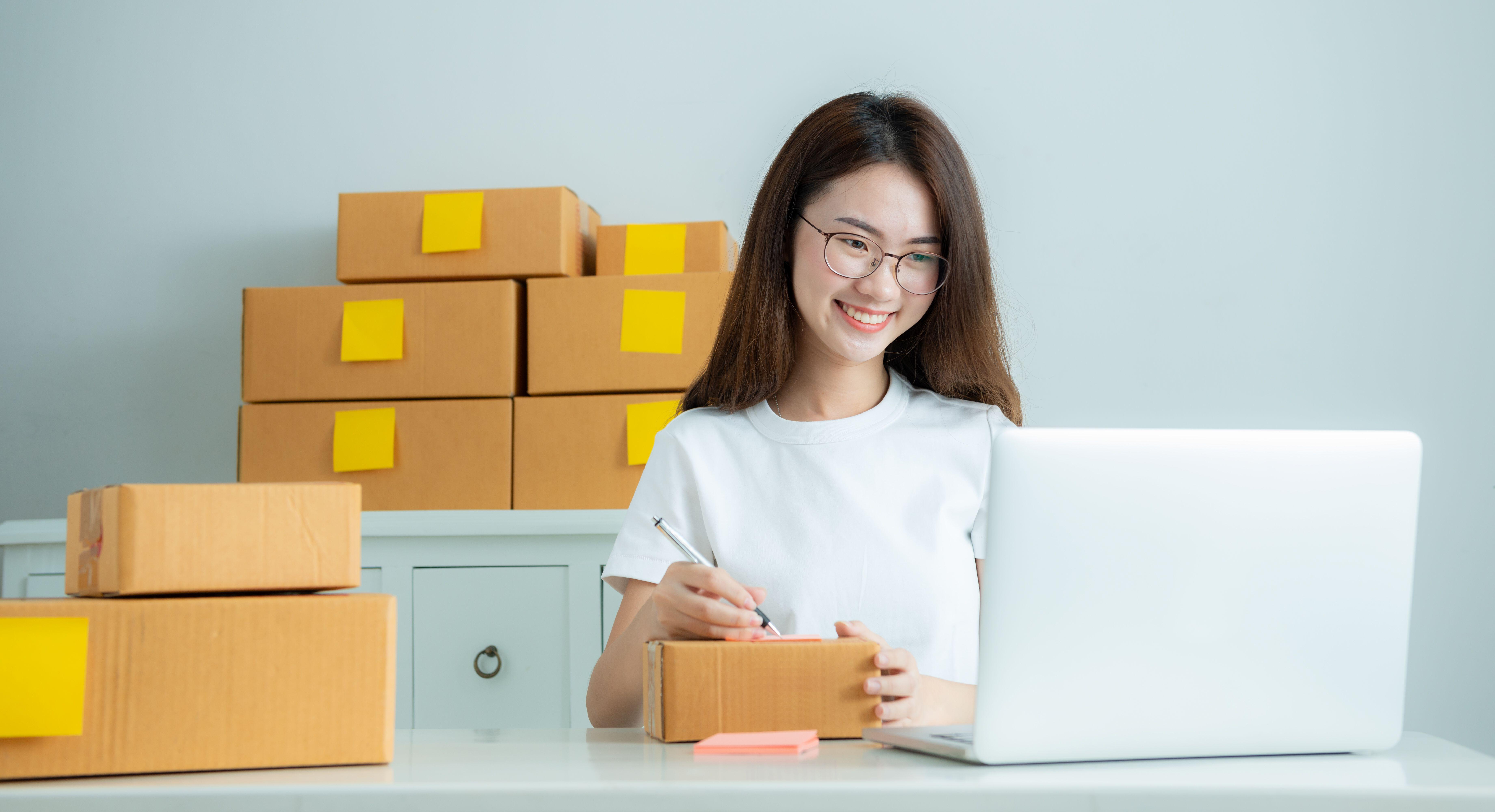 A woman receives orders from sales websites