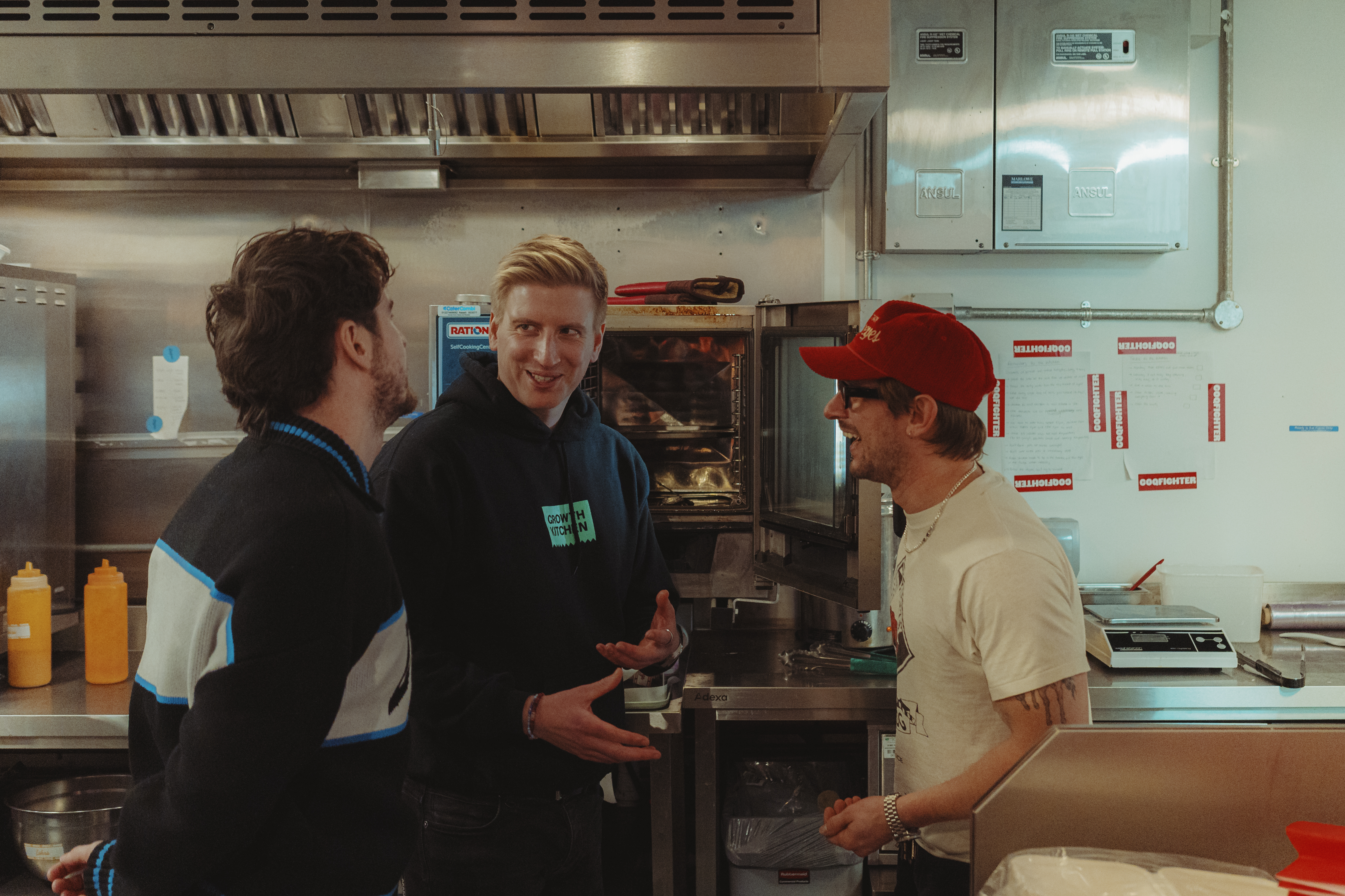 Tom Gatz, centre, in a kitchen