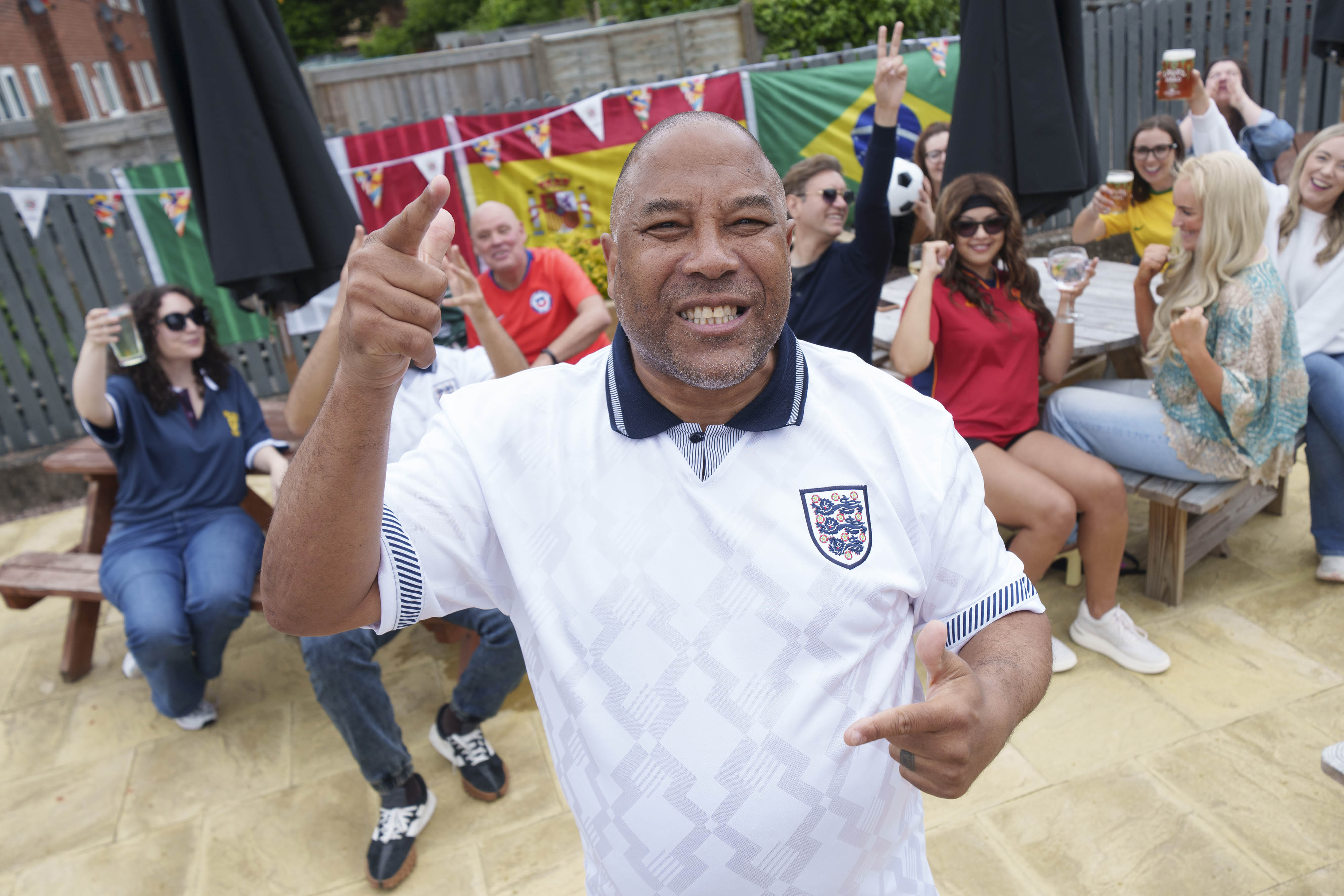 John Barnes wearing a retro England shirt 