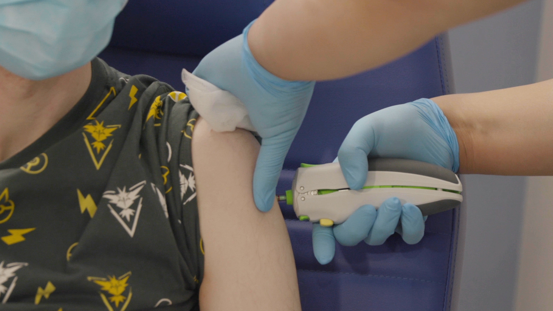 A jab being administered using a needle-free method
