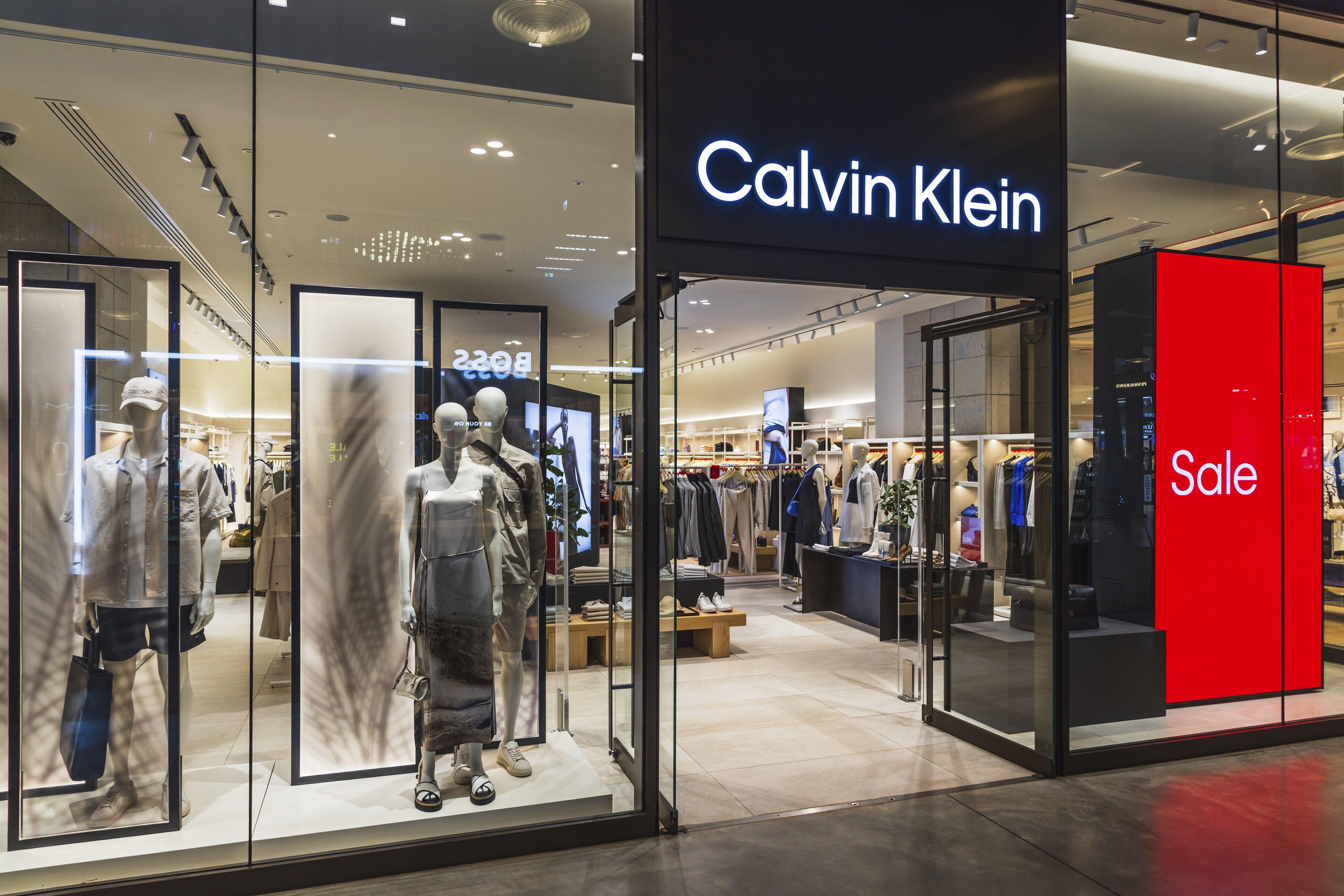 A Calvin Klein storefront featuring mannequins