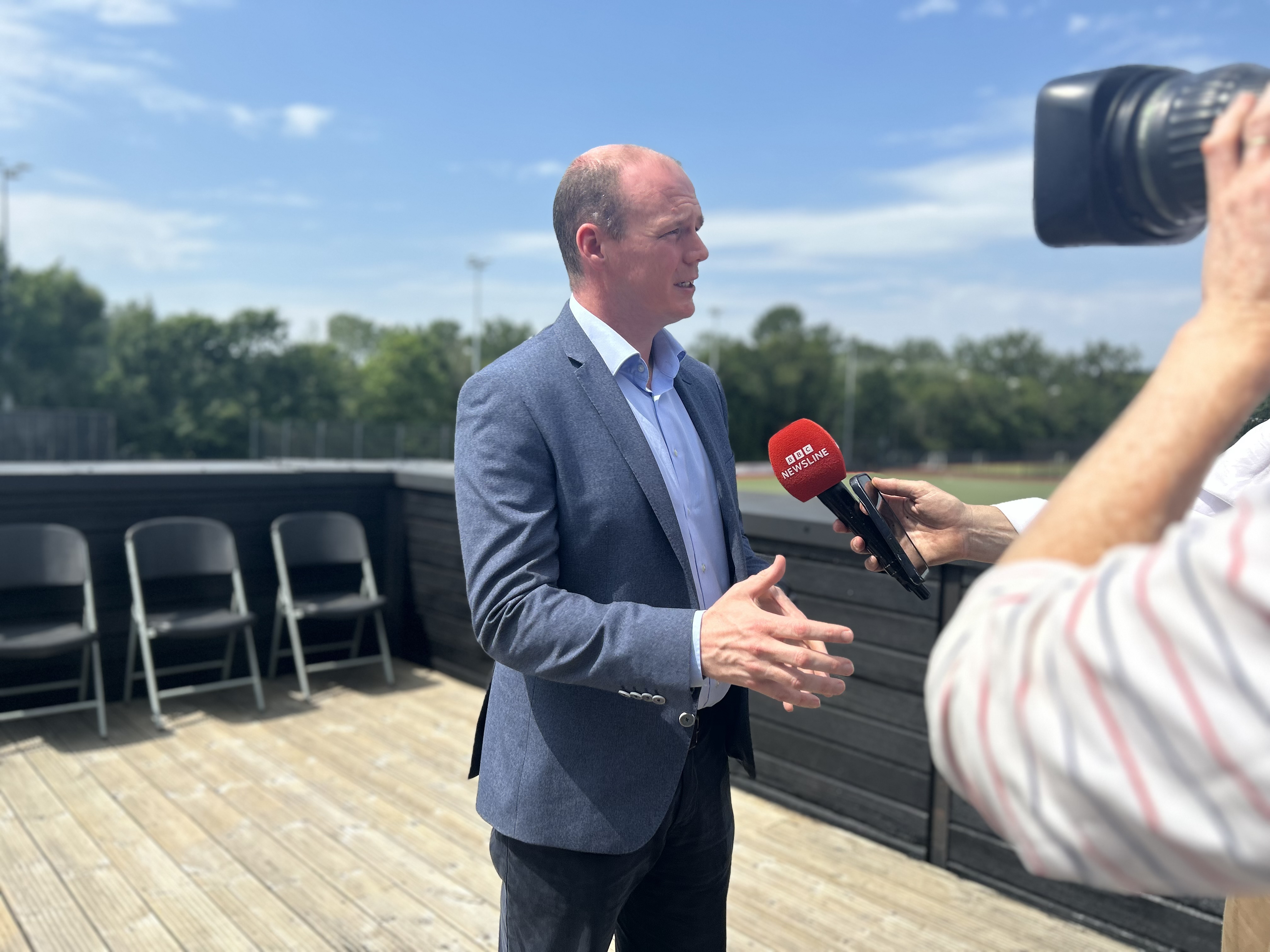 DUP Communities Minister Gordon Lyons speaking to the media