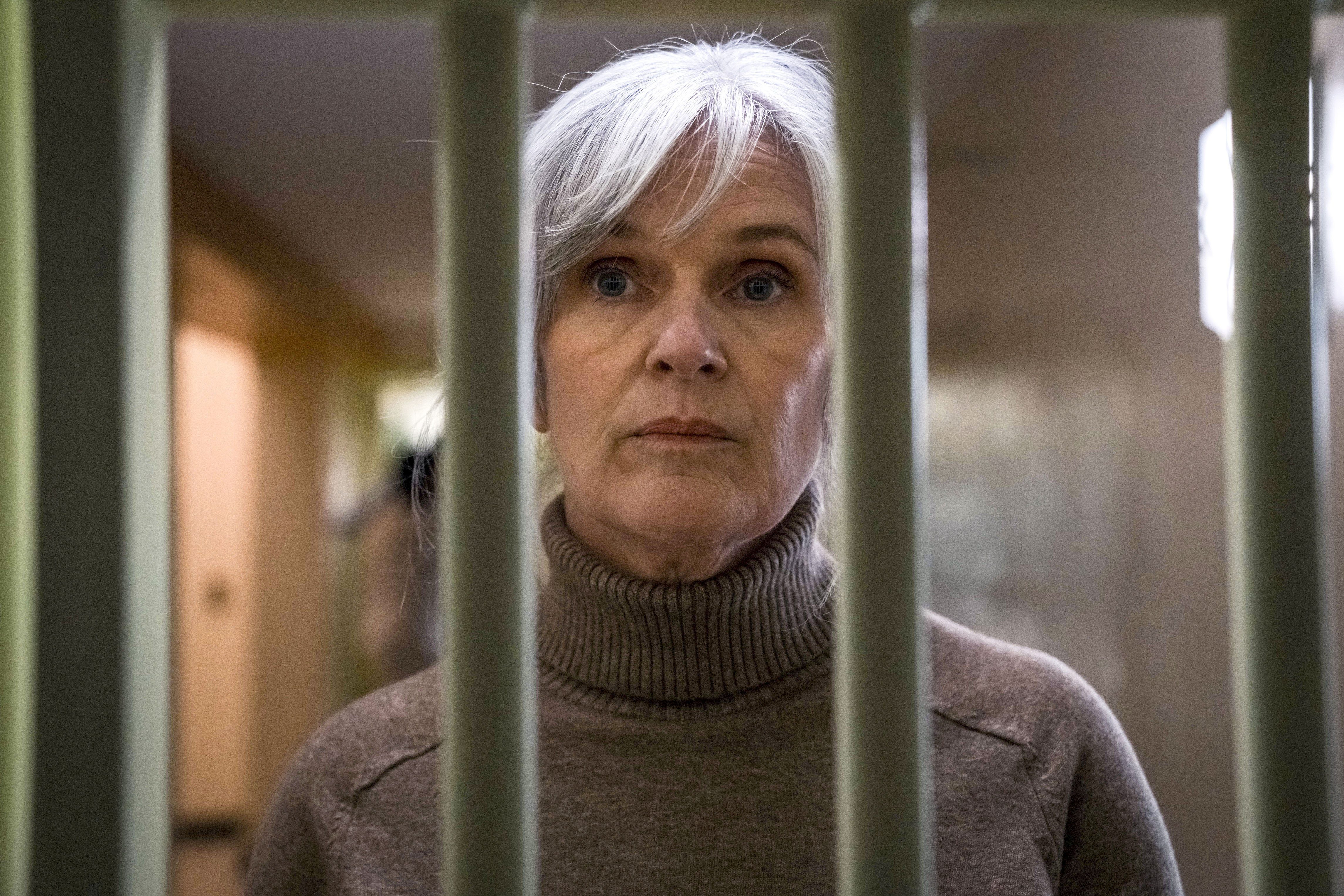 Siobhan Finneran, pictured through bars, in character on the set of Time