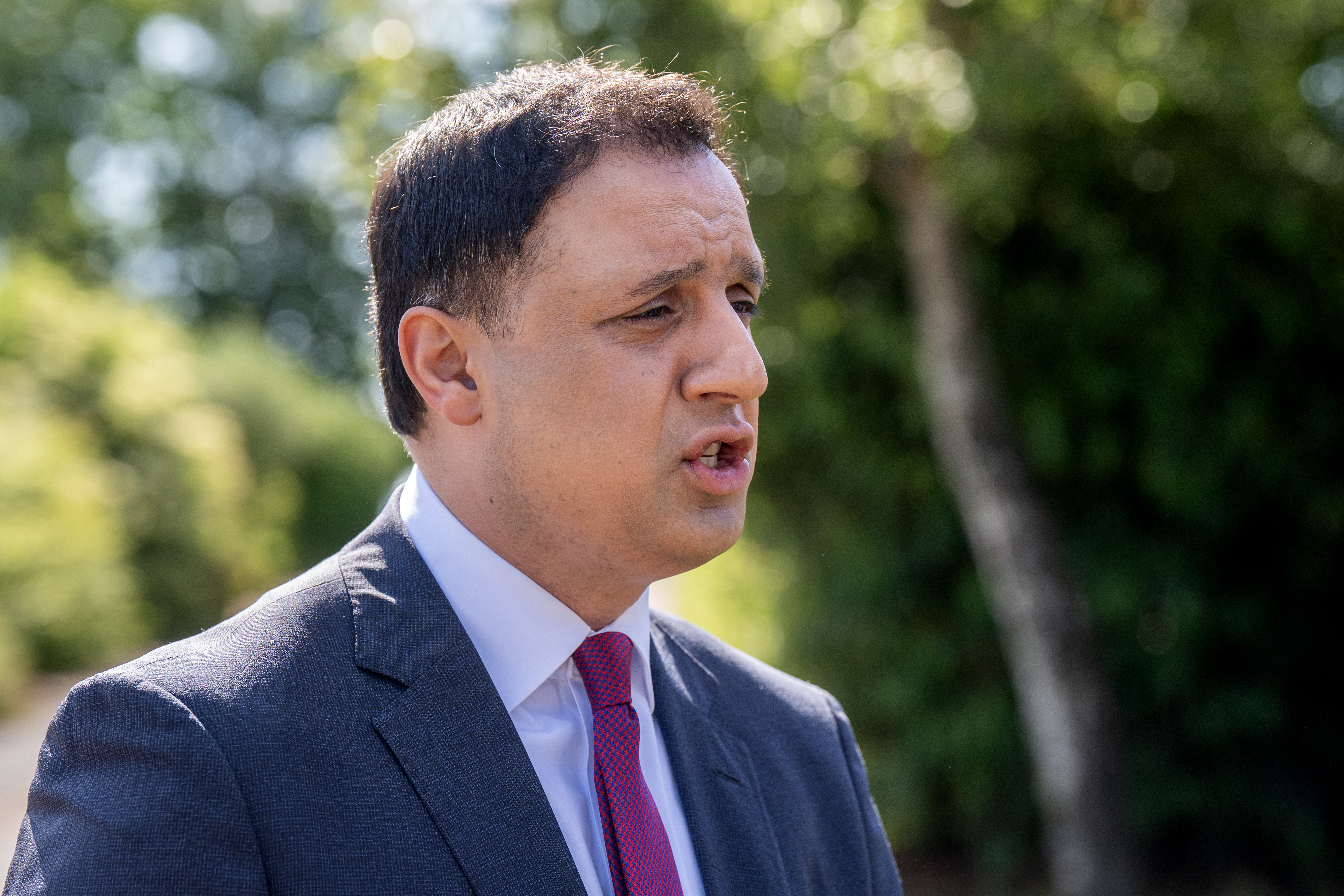 Side view of Anas Sarwar speaking