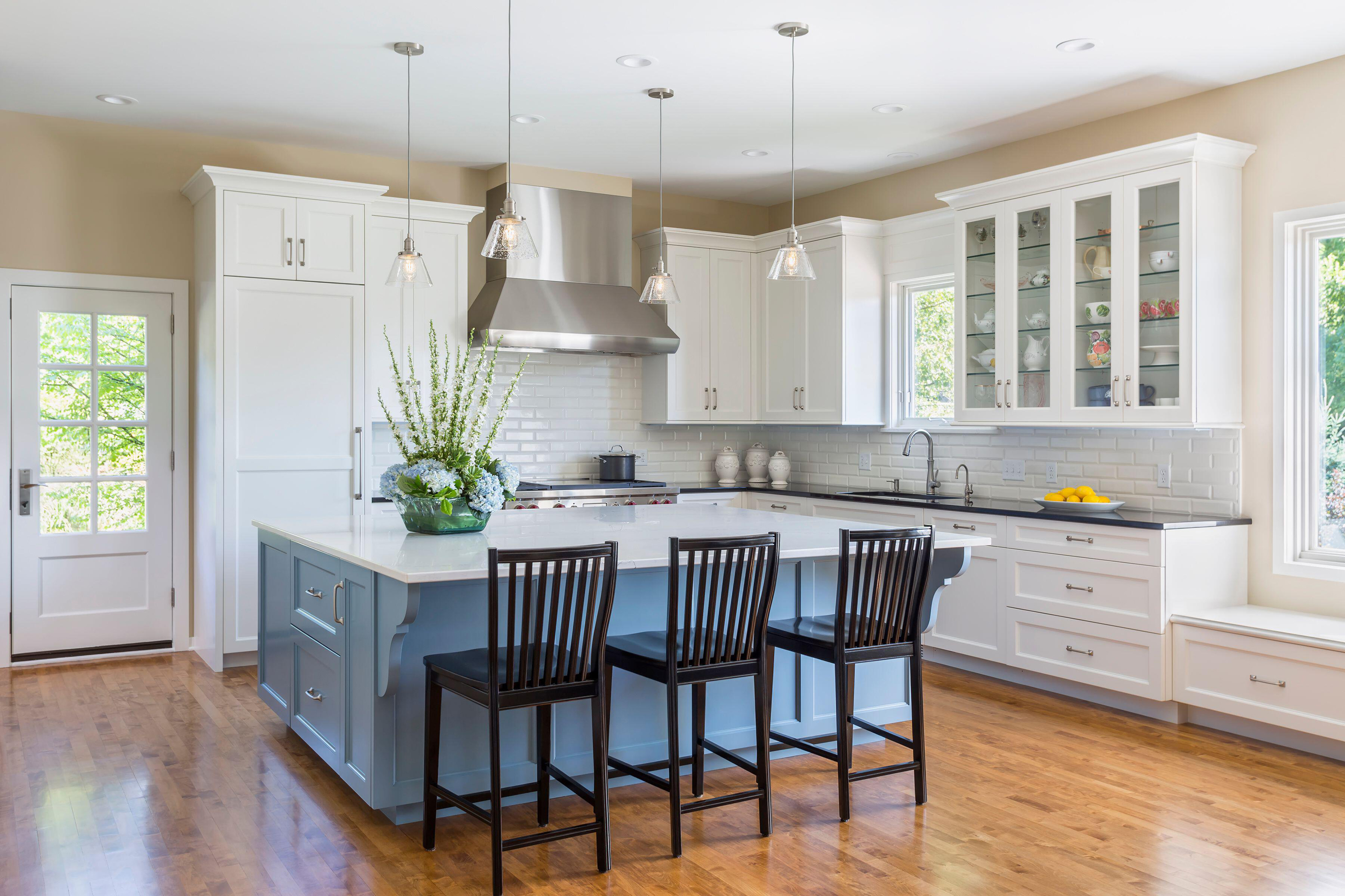 Modern kitchen with a kitchen island painted in blue