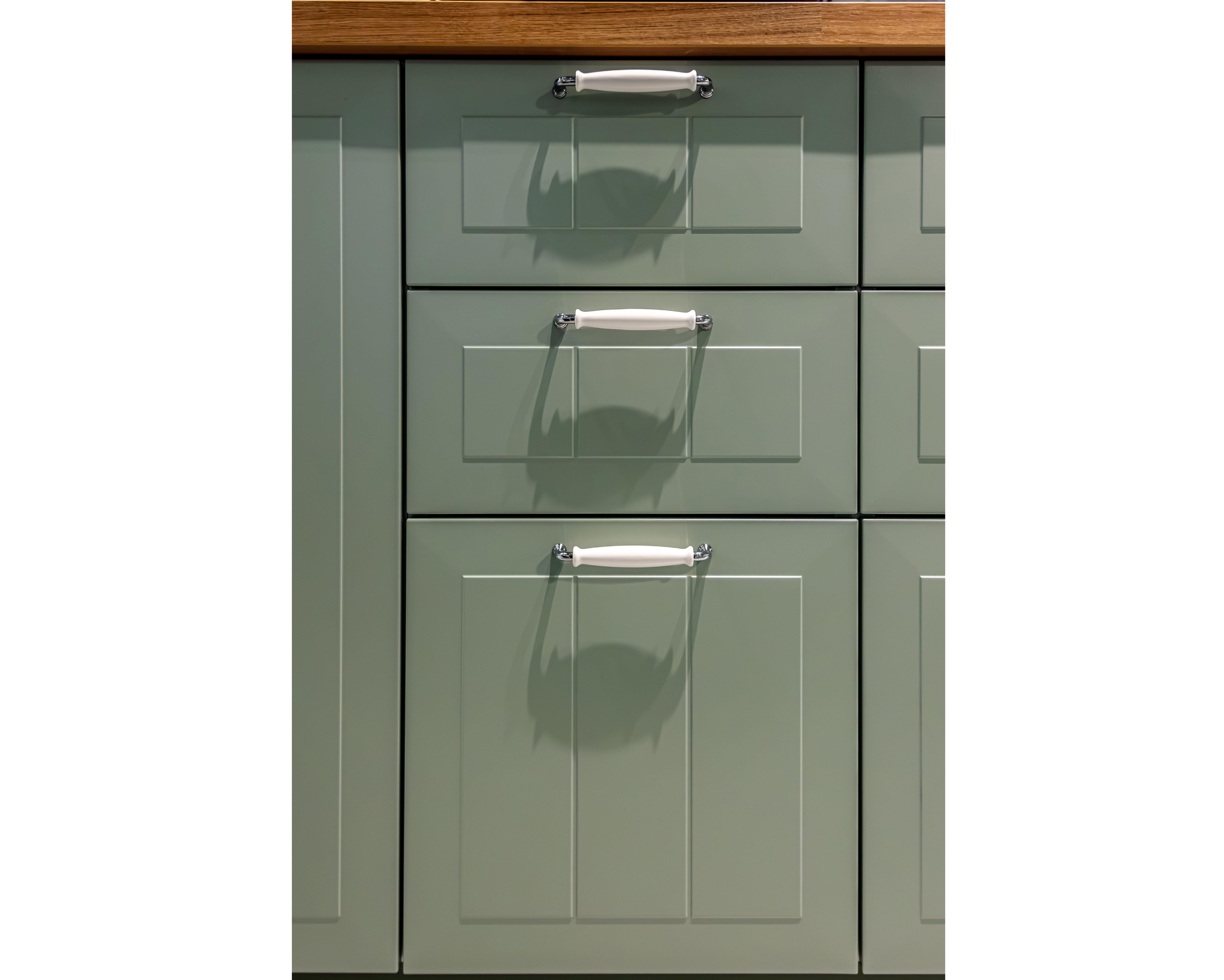 Sage green kitchen drawers with bar pull handles with