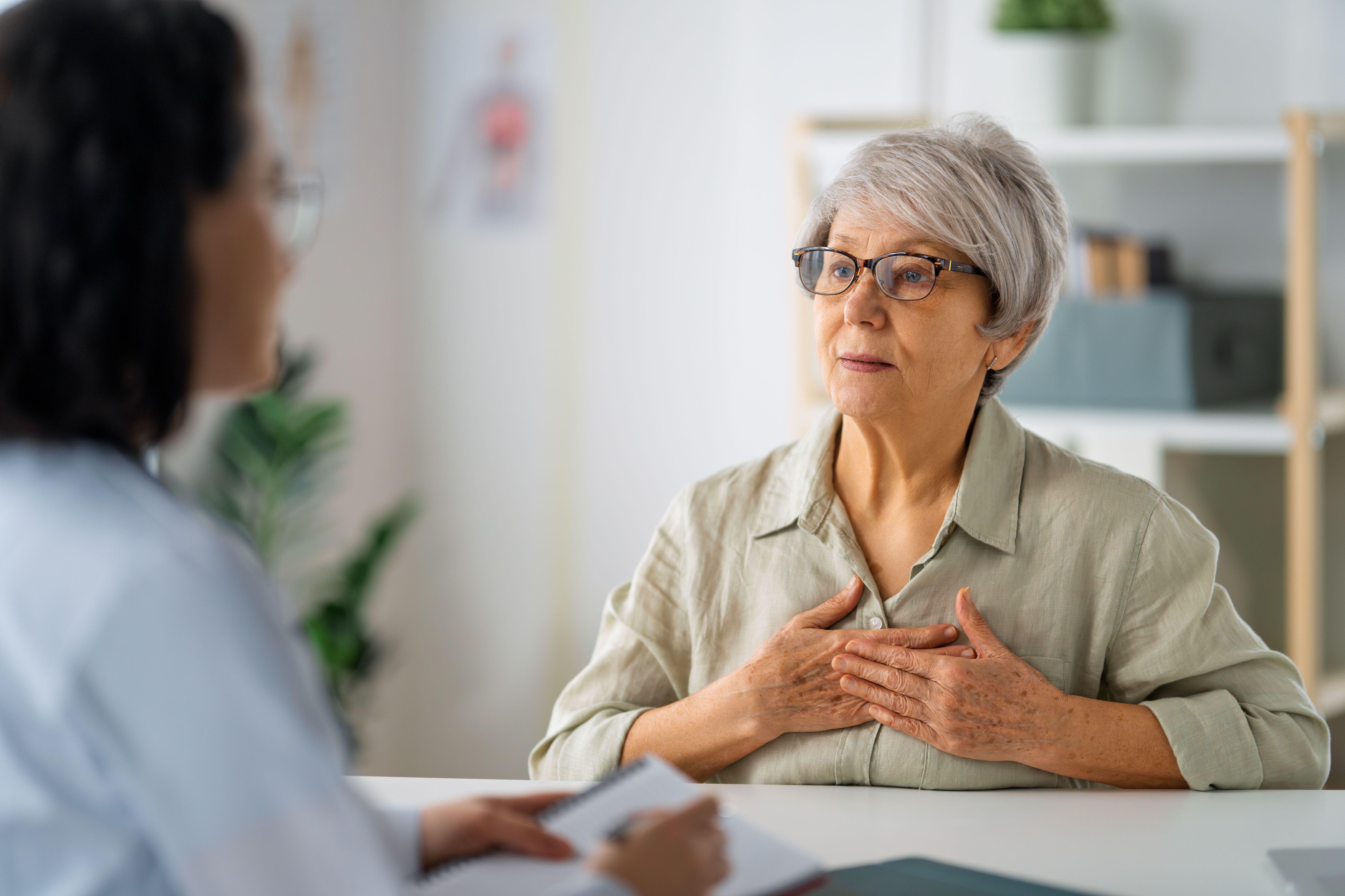 Middle-aged woman talking to a doctor
