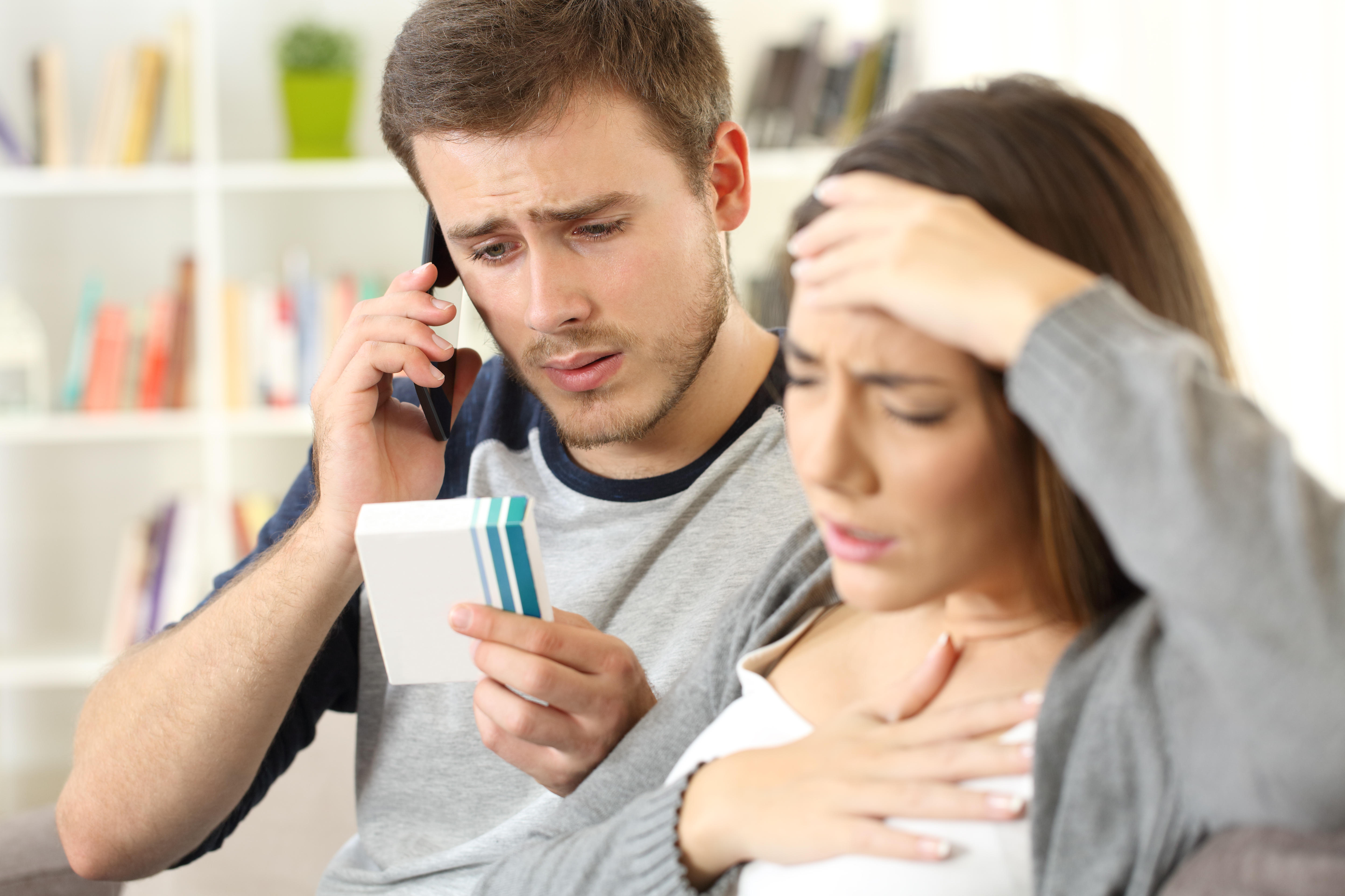 Young man calling doctor asking about woman's medicine allergy or side effects 