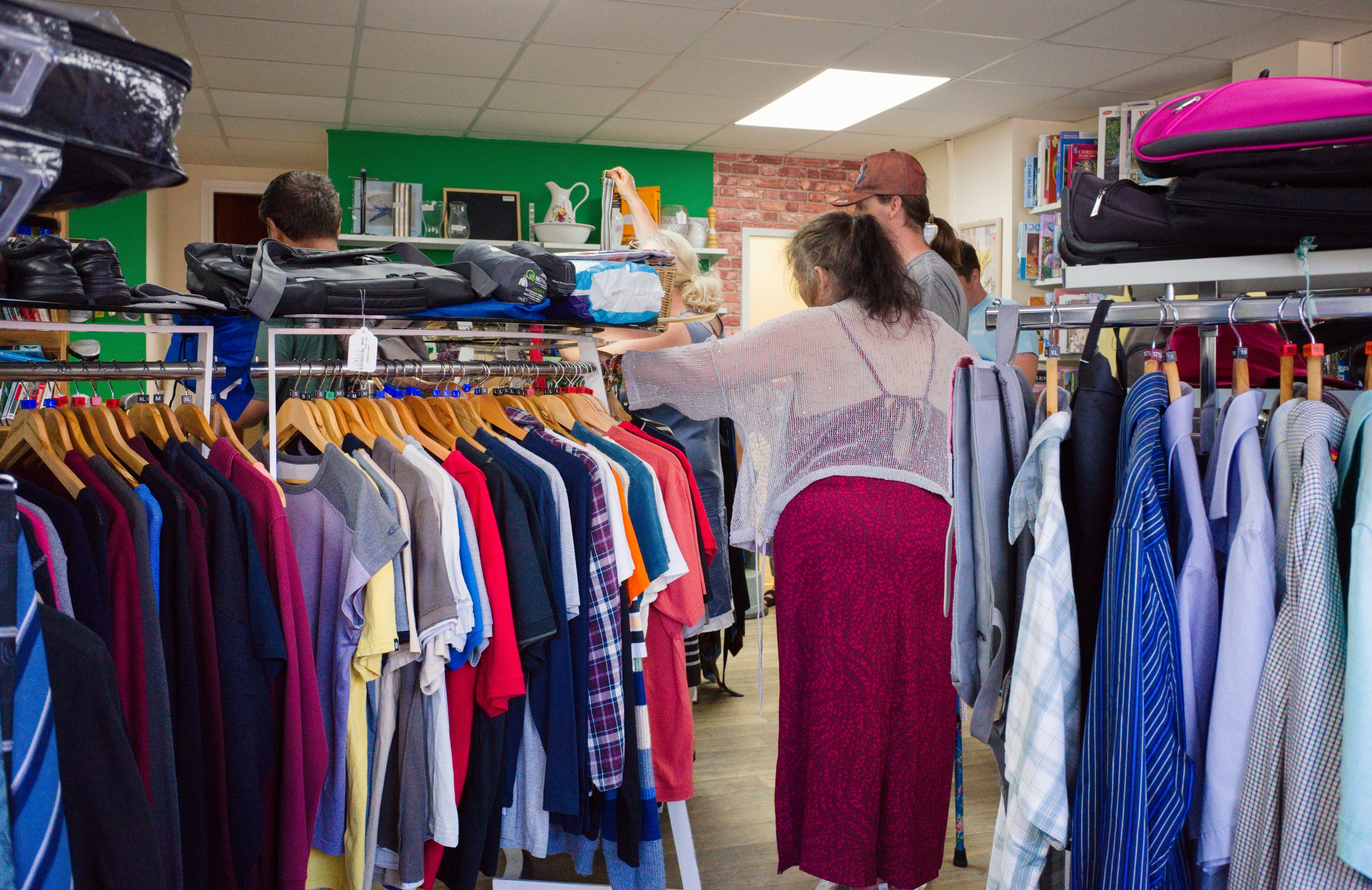 A person shopping in a charity shop