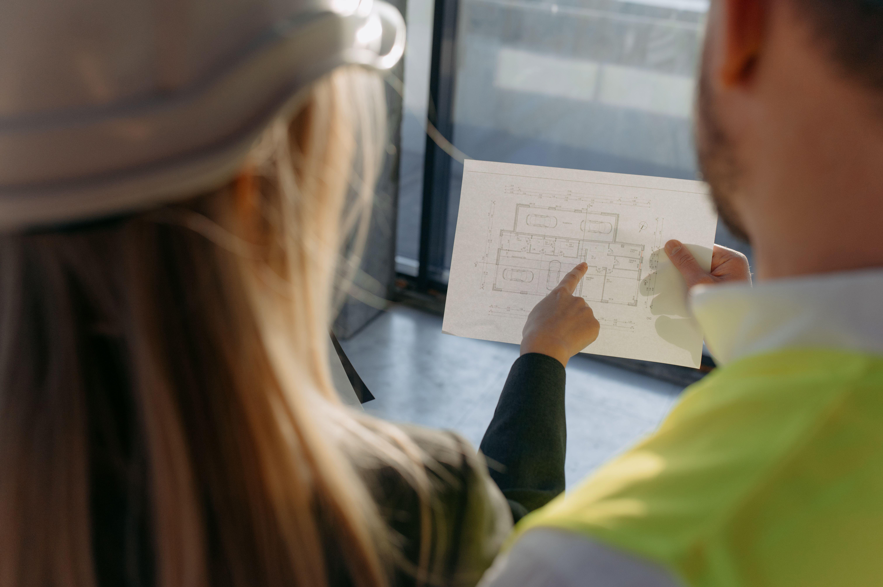 A couple studying a house project
